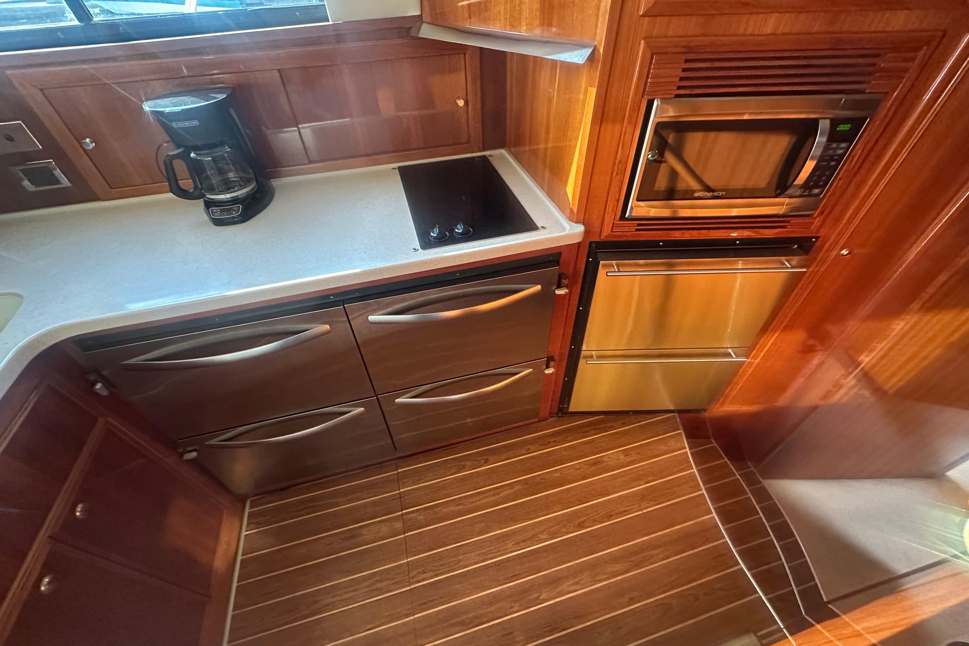 2007 Riviera Sport Fisherman kitchen with microwave, stove, and coffee maker.