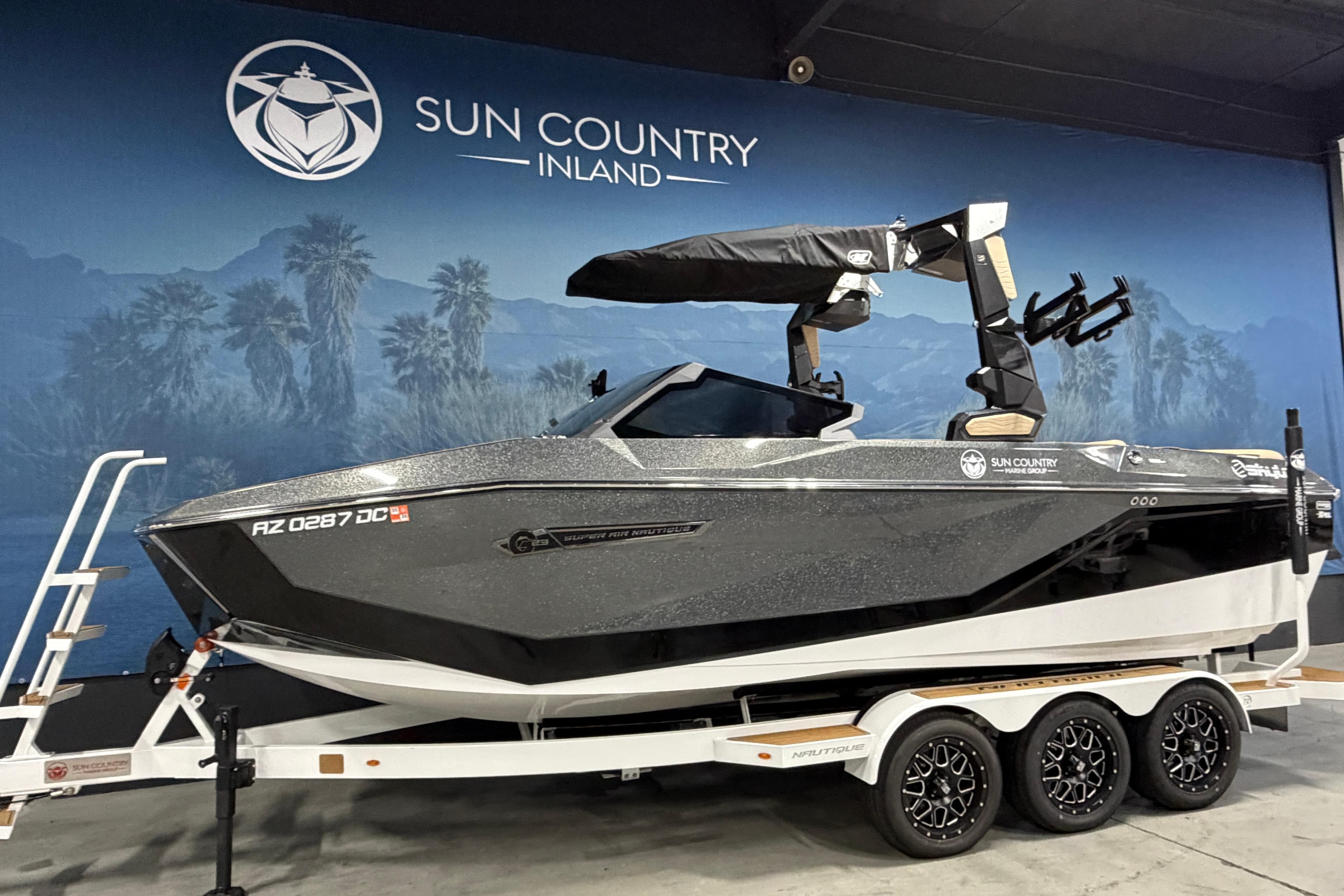 2025 Nautique Super Air Nautique G23 boat on trailer at Sun Country Inland showroom.