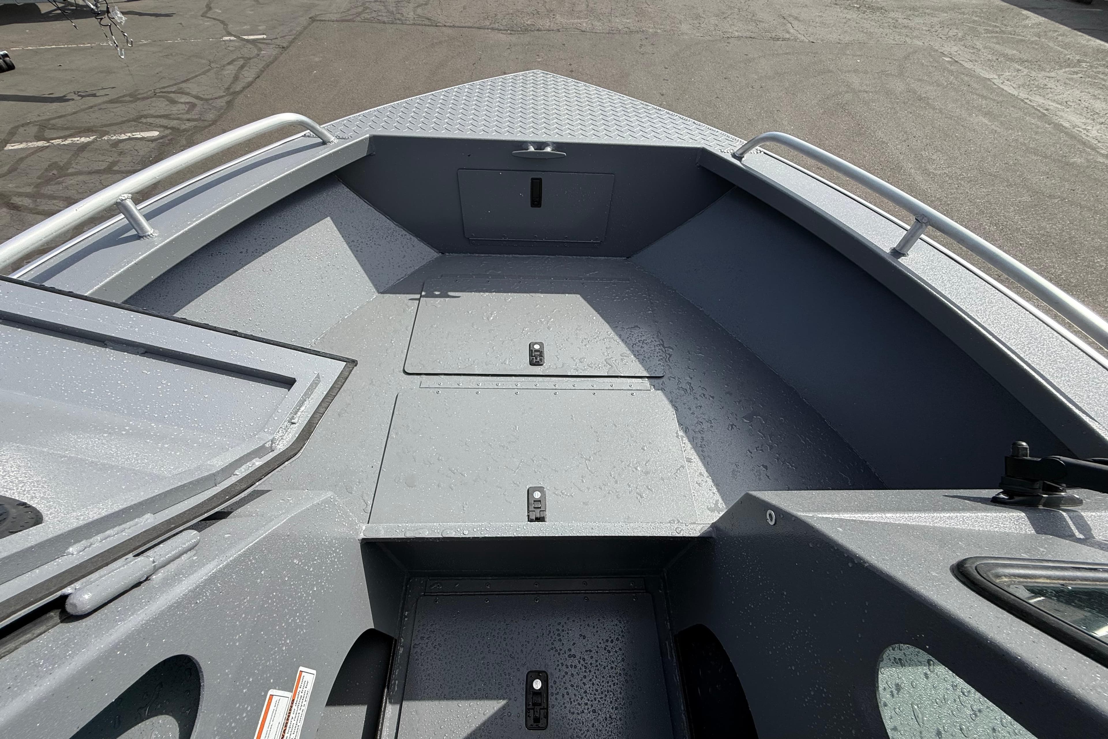 2026 Alumaweld Stryker X202 boat interior with storage compartments and sleek design.