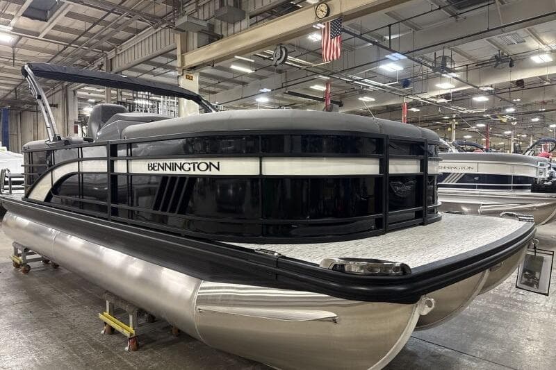 2025 Bennington 22 LSRSE pontoon boat in a factory setting, showcasing sleek design.