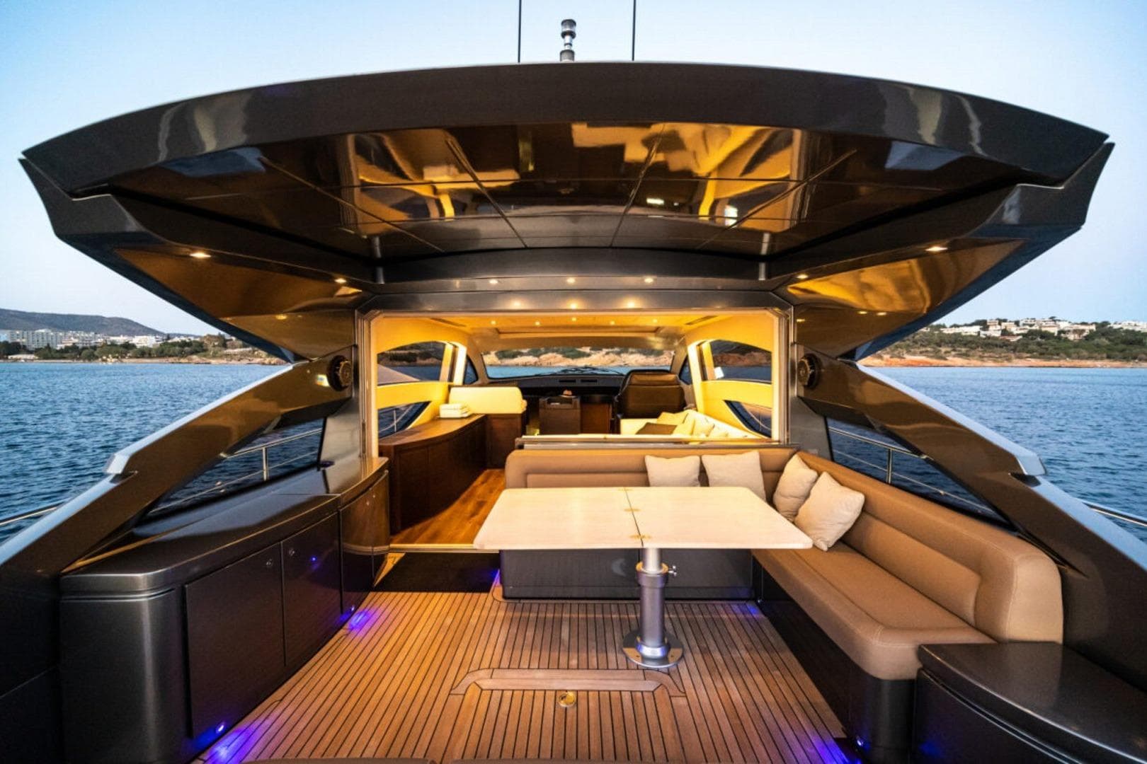 Luxurious 2008 Pershing 64' yacht interior with elegant seating and scenic ocean view.
