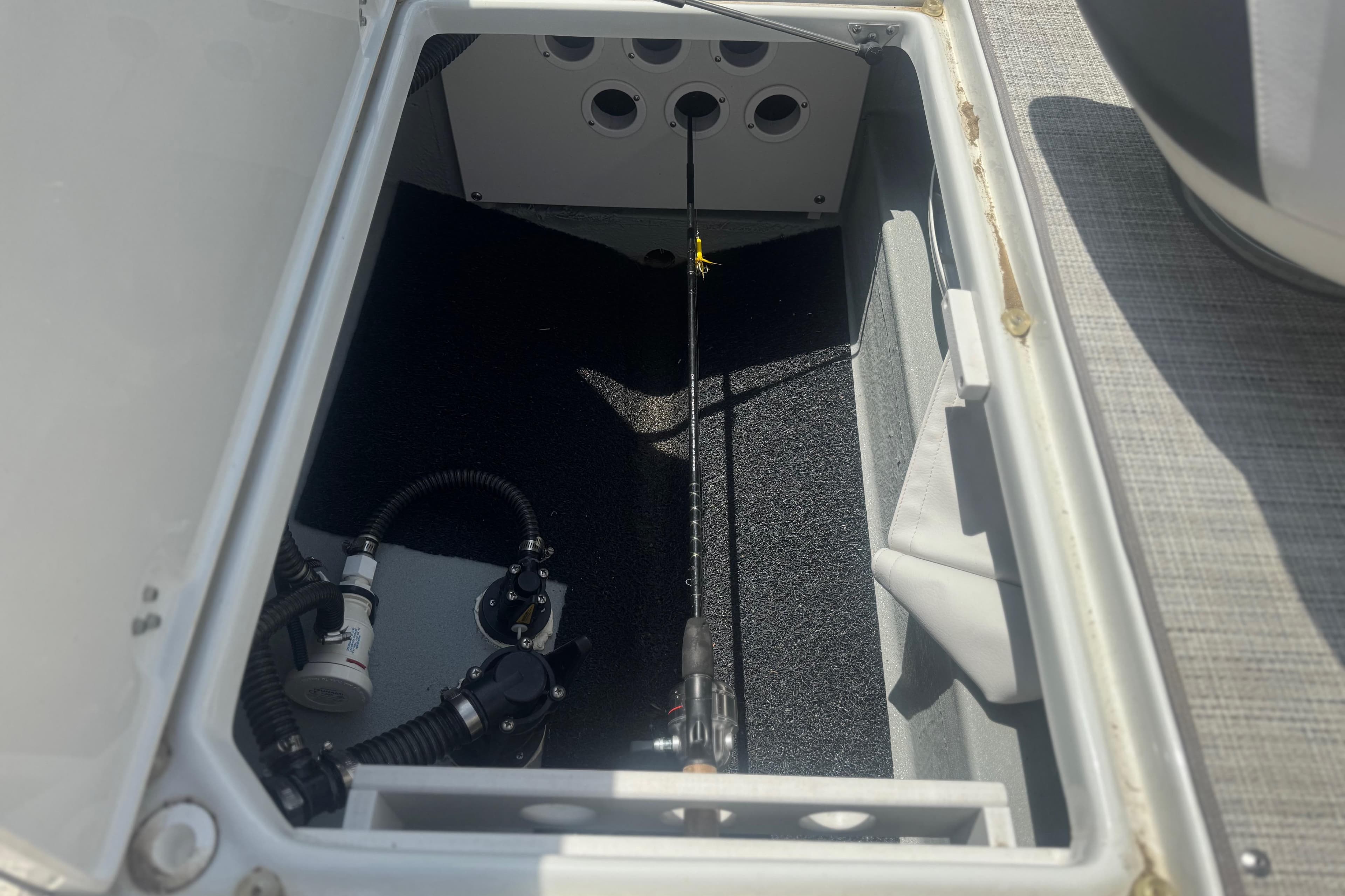 Open storage compartment in 2022 Crownline Eclipse E205 XS Fish boat.