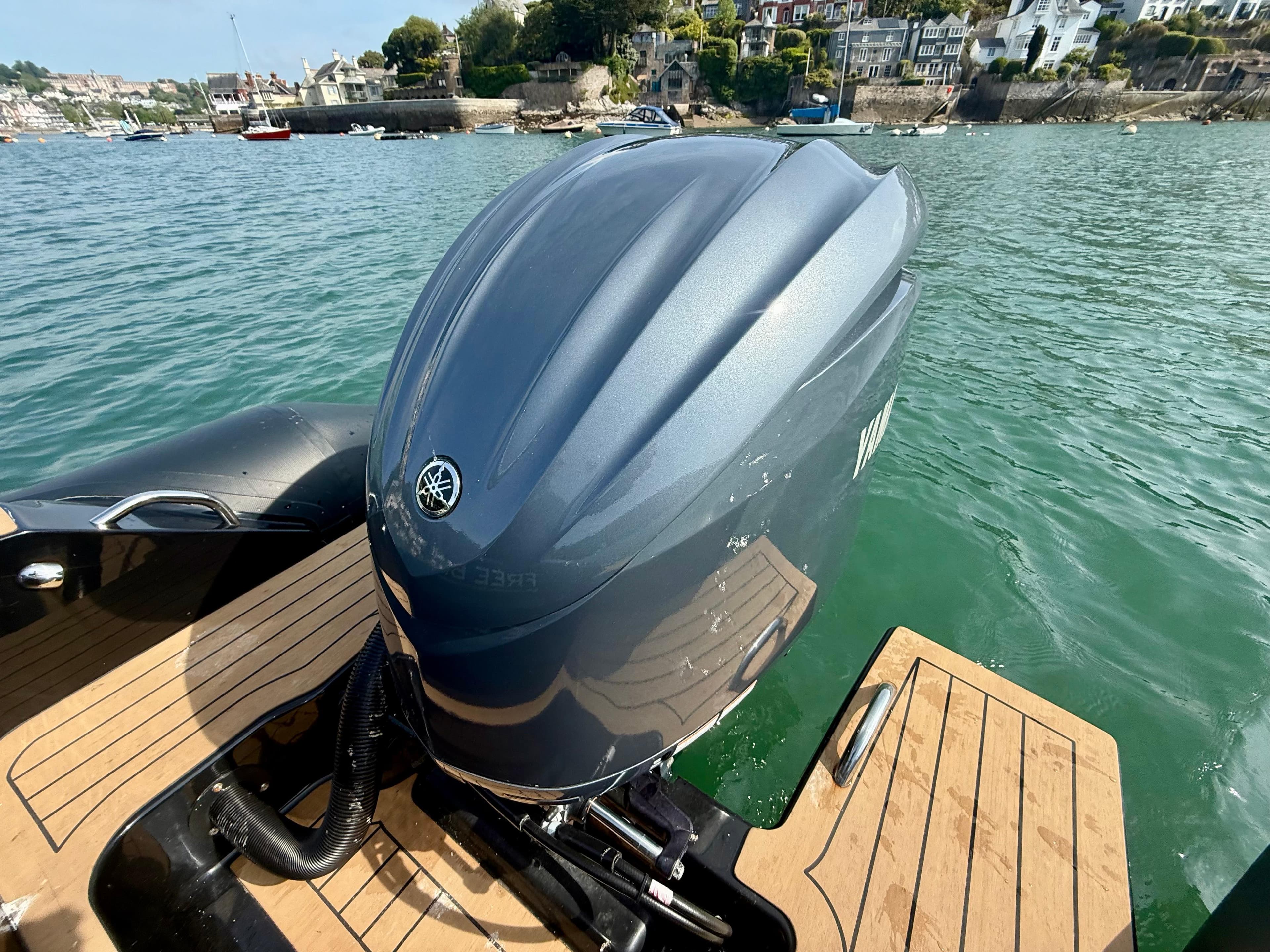 Ribeye A683 boat with Yamaha outboard motor on calm water, 2023 model.
