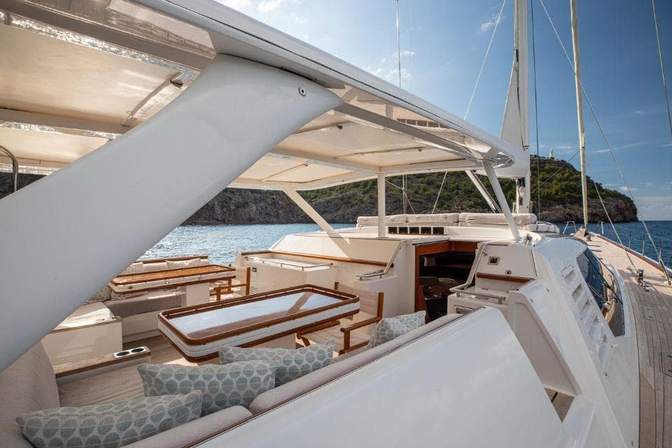Luxurious Nautor Swan 112 RS yacht deck with elegant seating, overlooking serene ocean waters.
