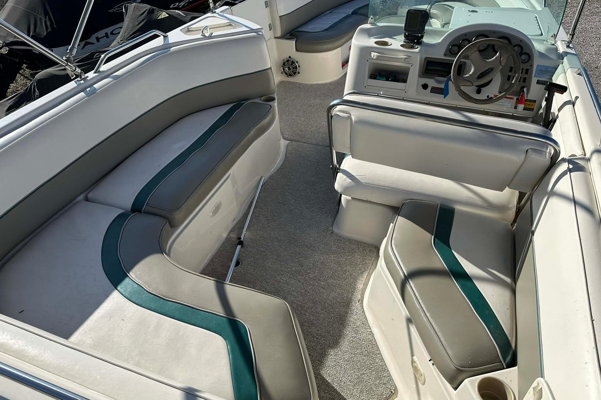 1998 Bayliner 2659 Rendezvous boat interior with seating and steering wheel.
