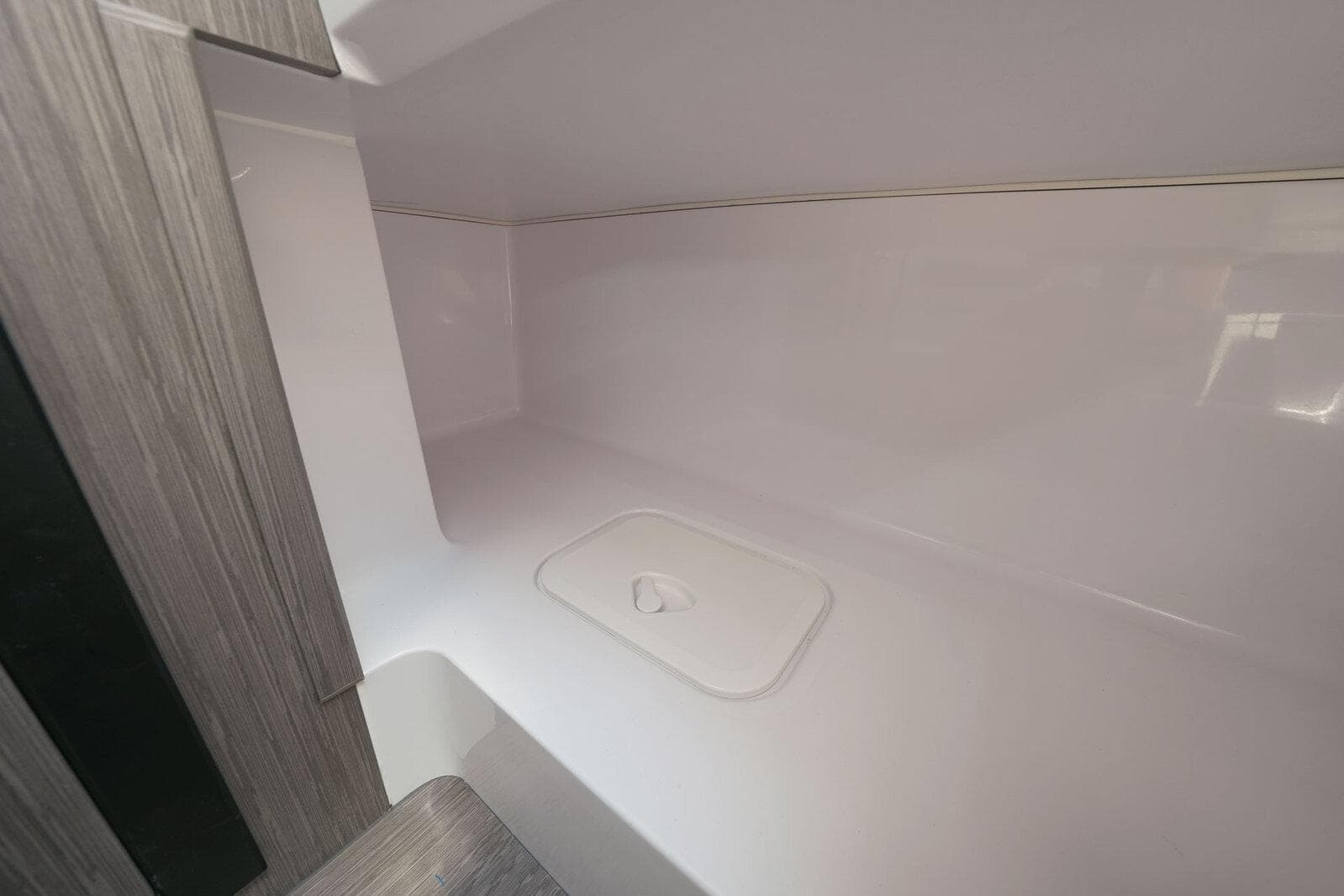 Interior cabin of 2025 Ranieri NEXT 255 LX boat, featuring sleek, modern design.