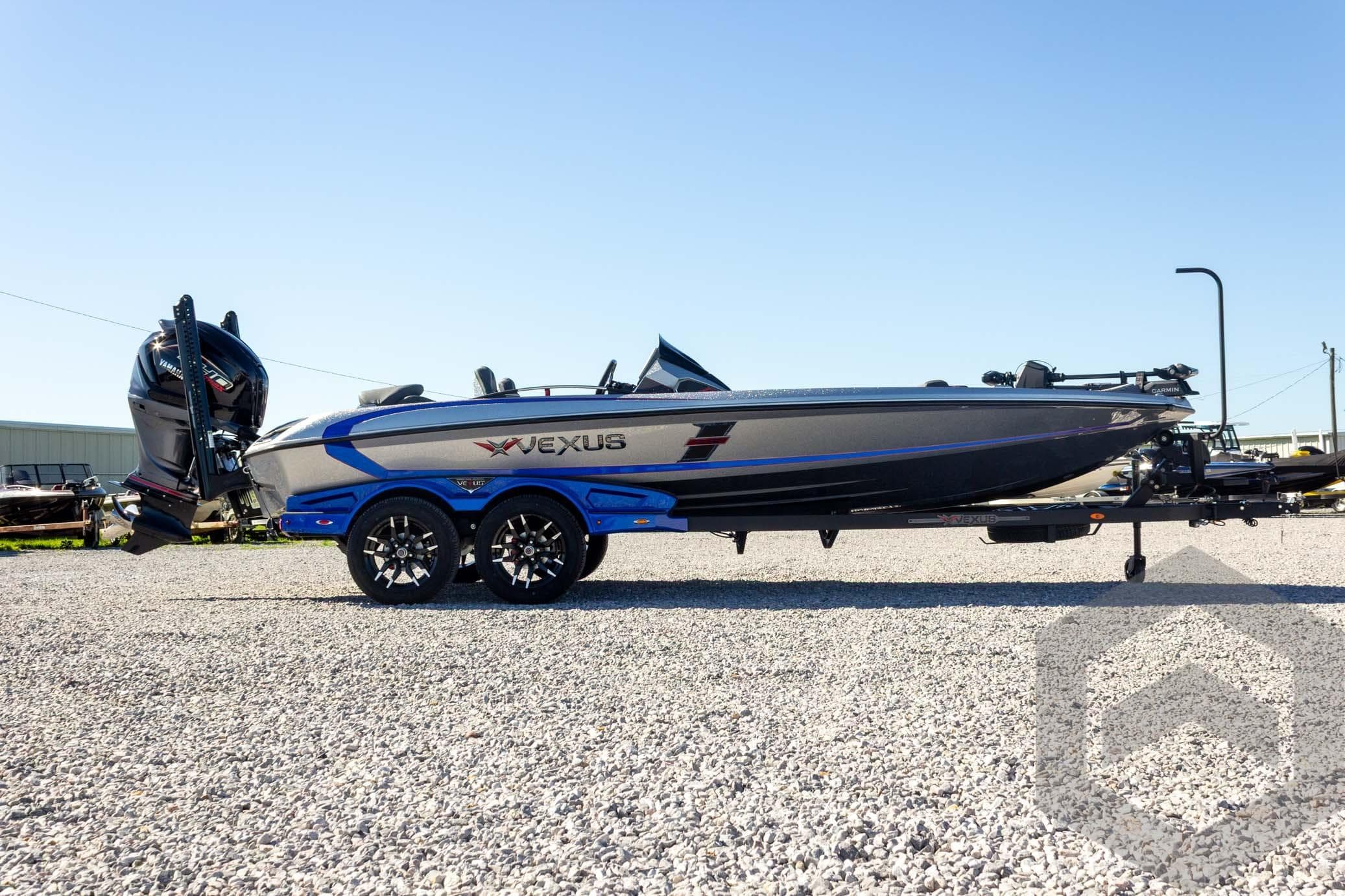 2026 Vexus VXs21 boat on trailer, side view, parked on gravel.
