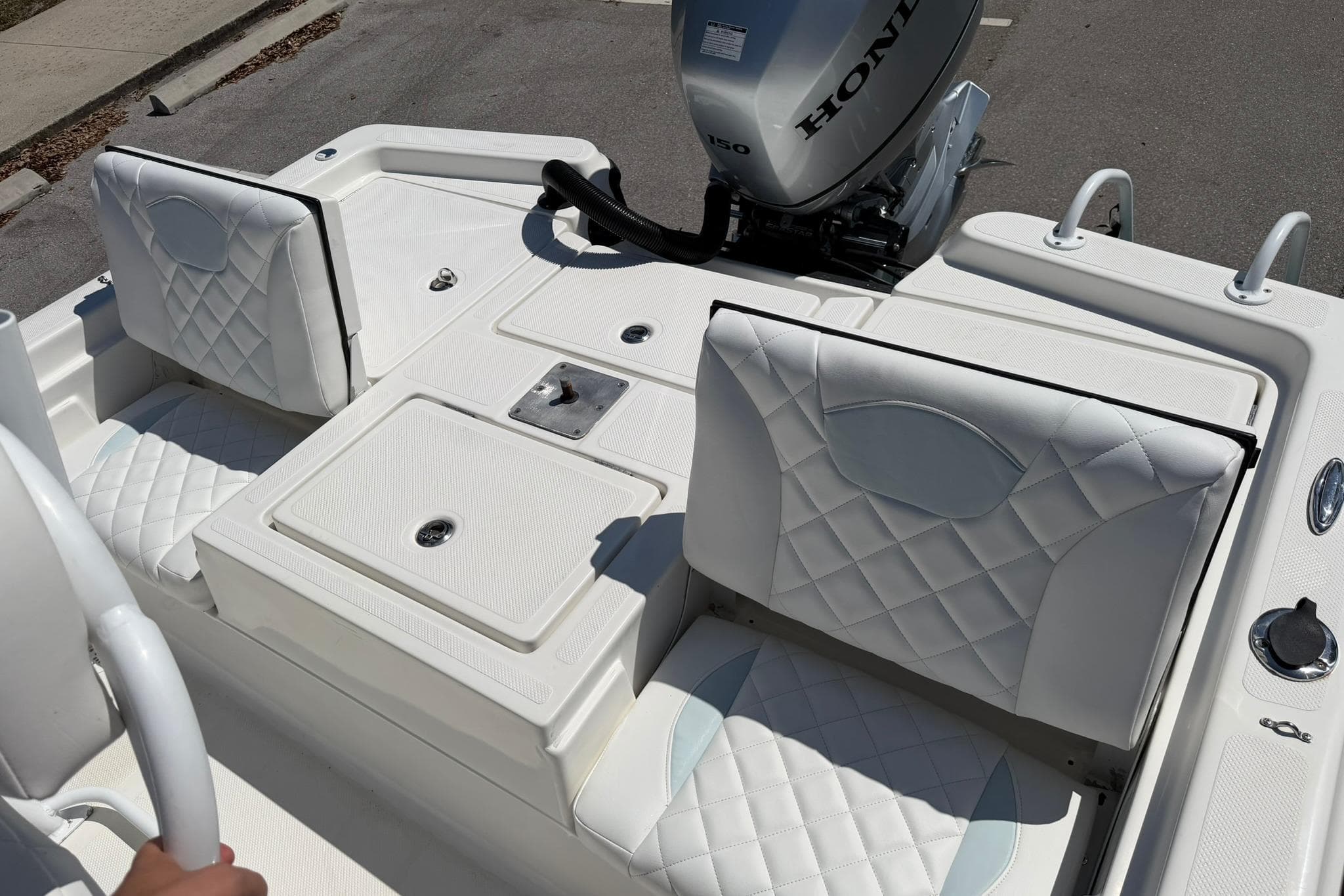2018 Epic 22SC boat interior with quilted seats and Honda outboard motor.