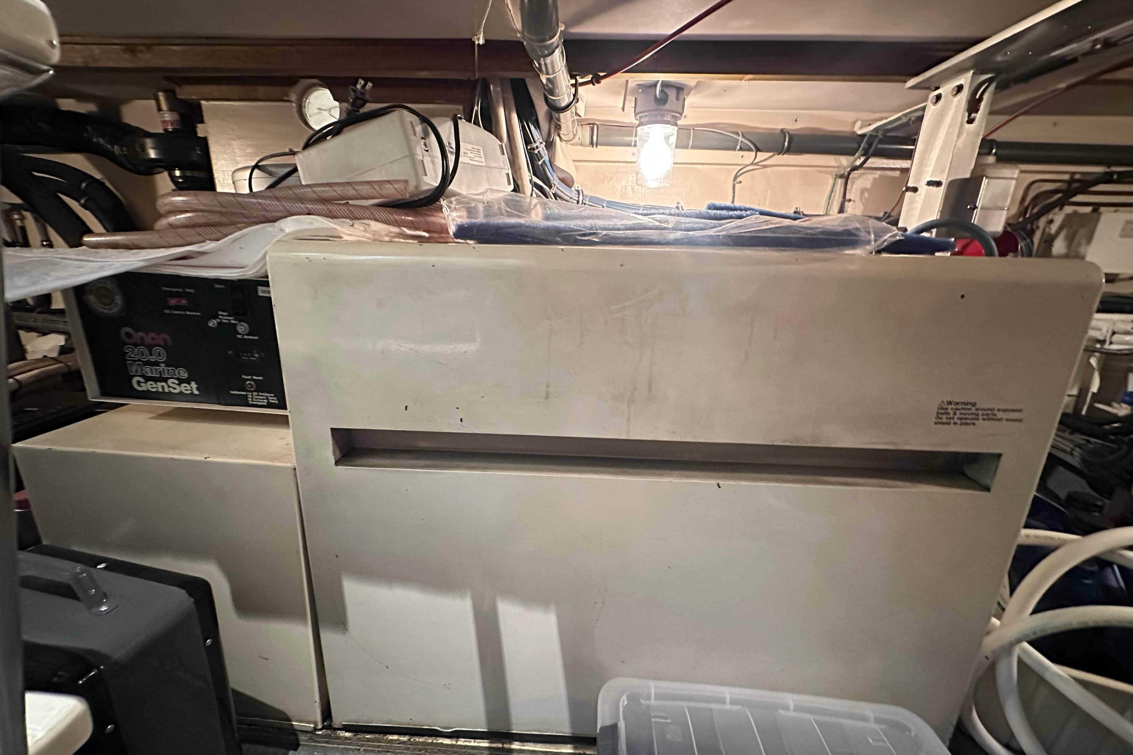 Engine room of 1992 Hatteras 65 Motor Yacht with Onan marine generator.