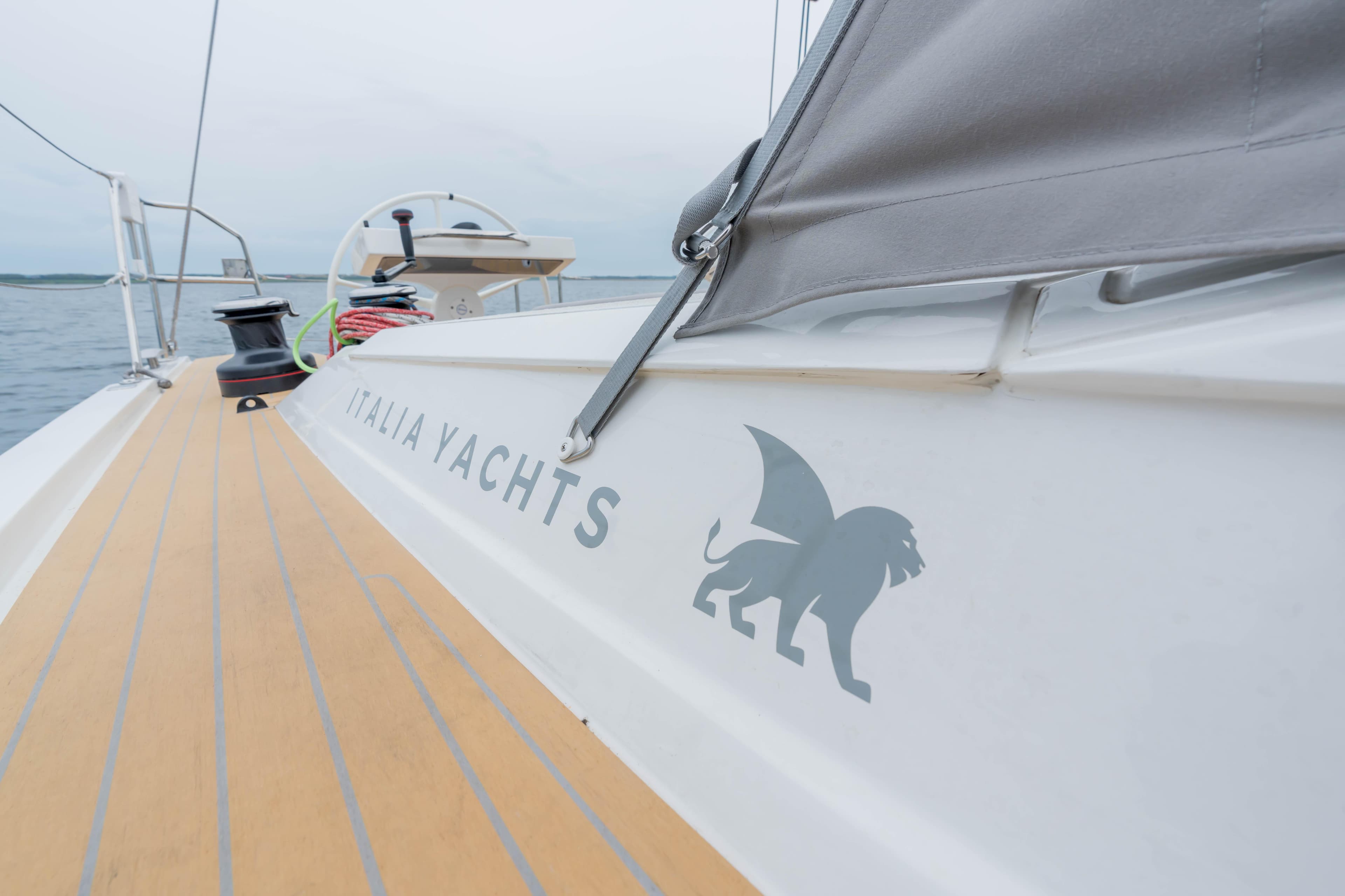 Italia Yachts 12.98, 2023 model, deck view with logo and lion emblem.