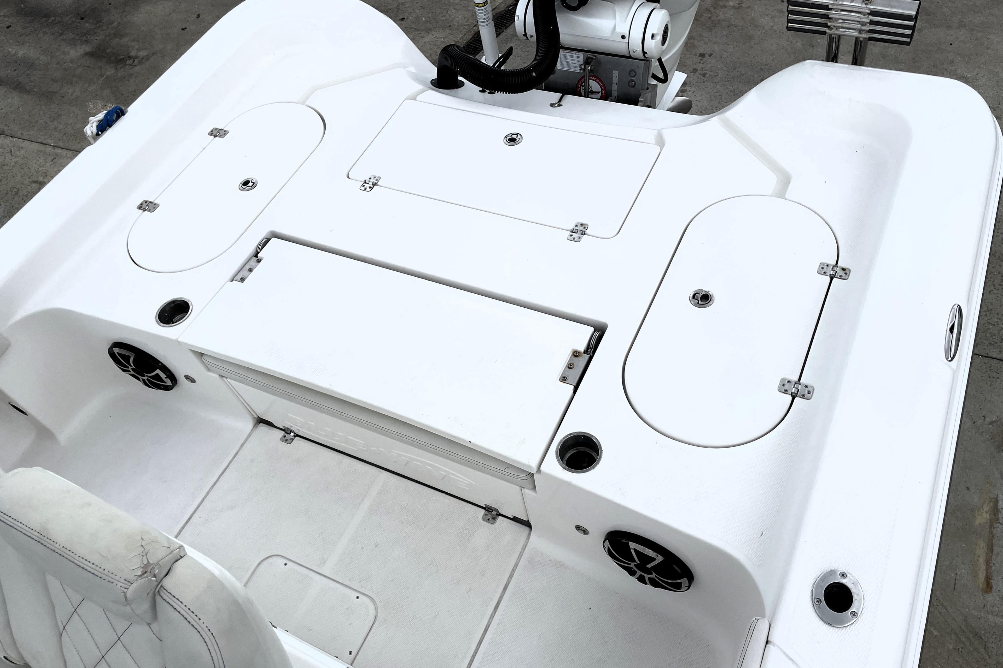 2019 Blue Wave 2800 Pure Hybrid boat deck with storage compartments and seating.