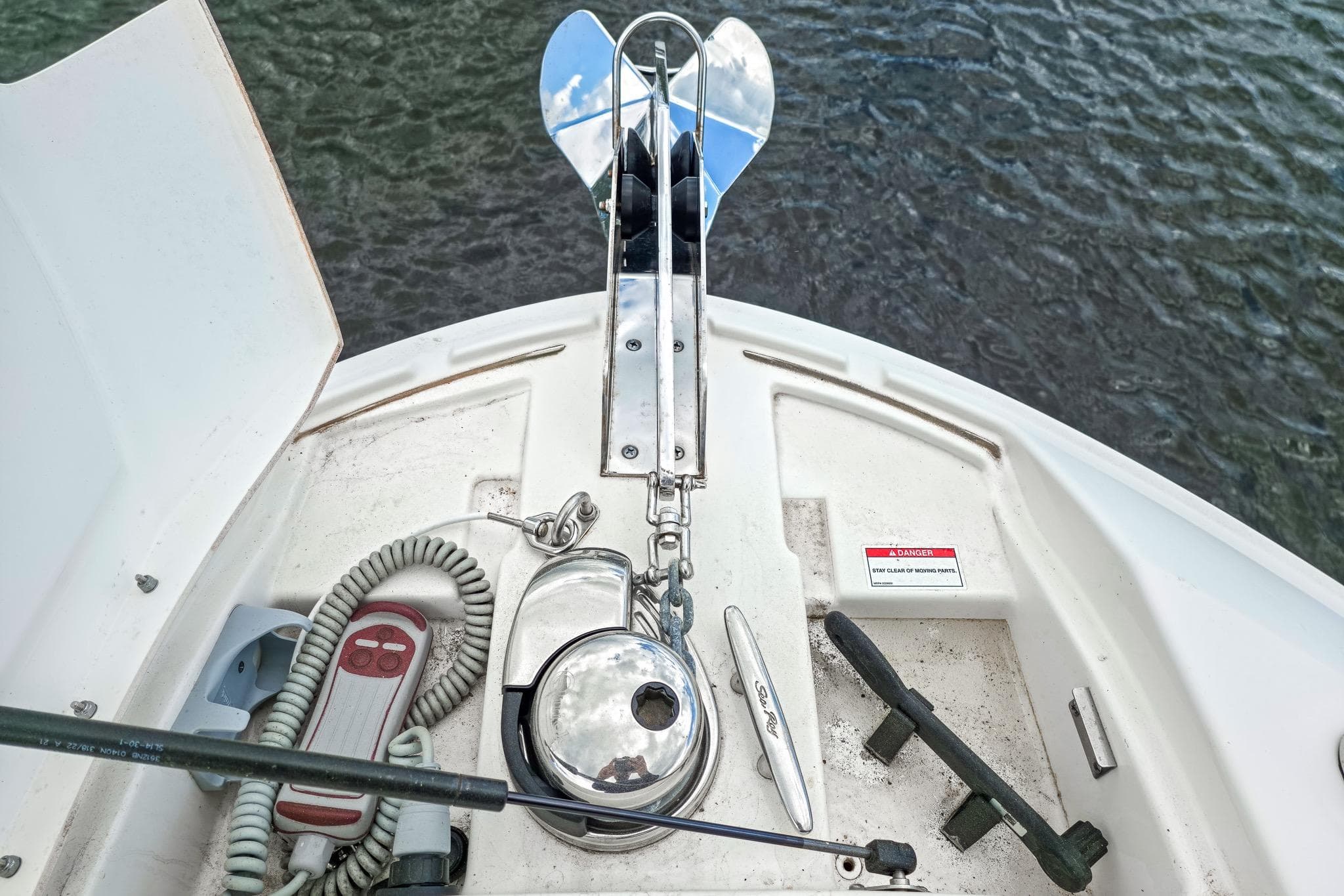 2023 Sea Ray SLX 310 Outboard boat anchor system with control panel and safety warning.