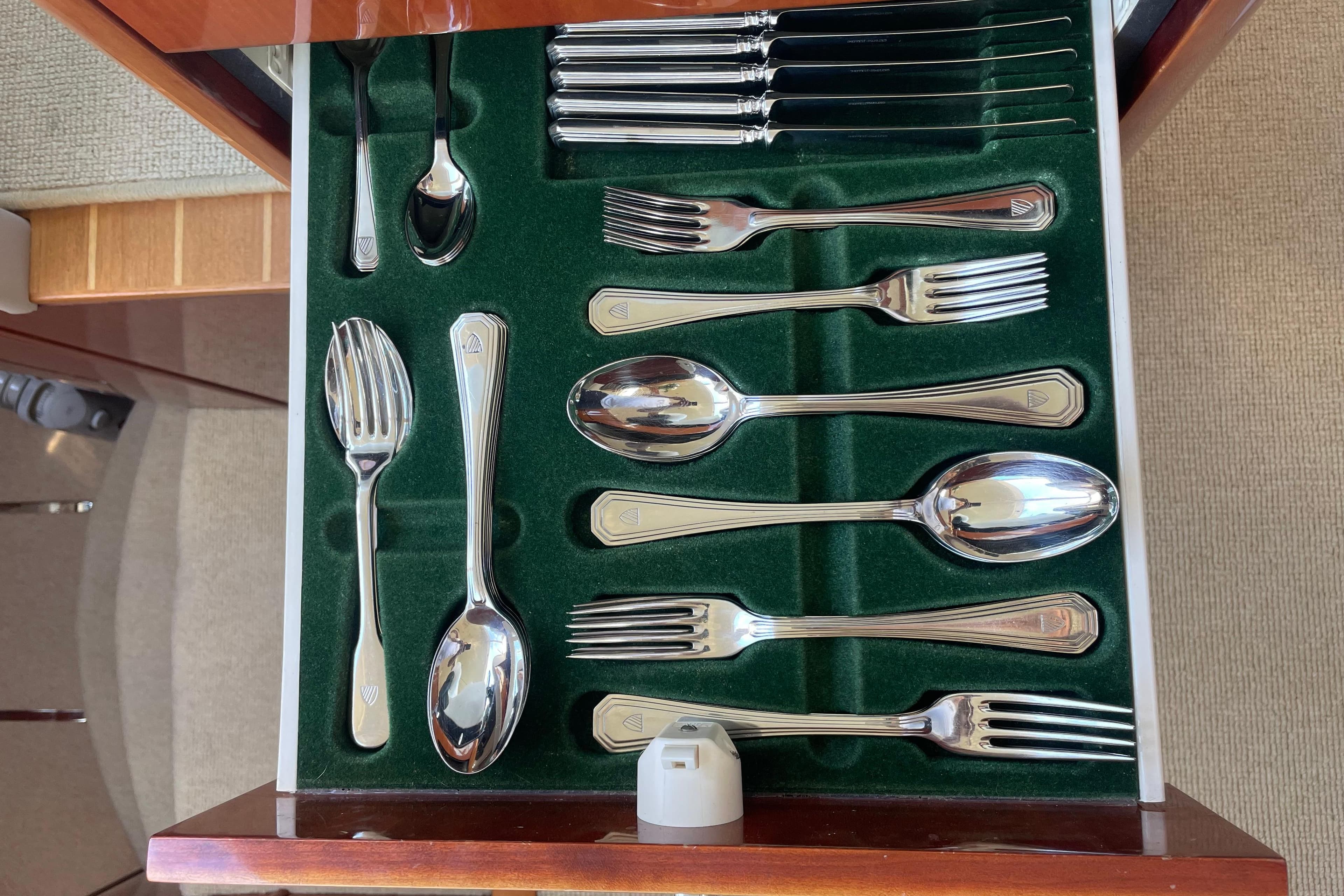Silver cutlery set in a drawer on a 2001 Fairline Squadron 58 yacht.