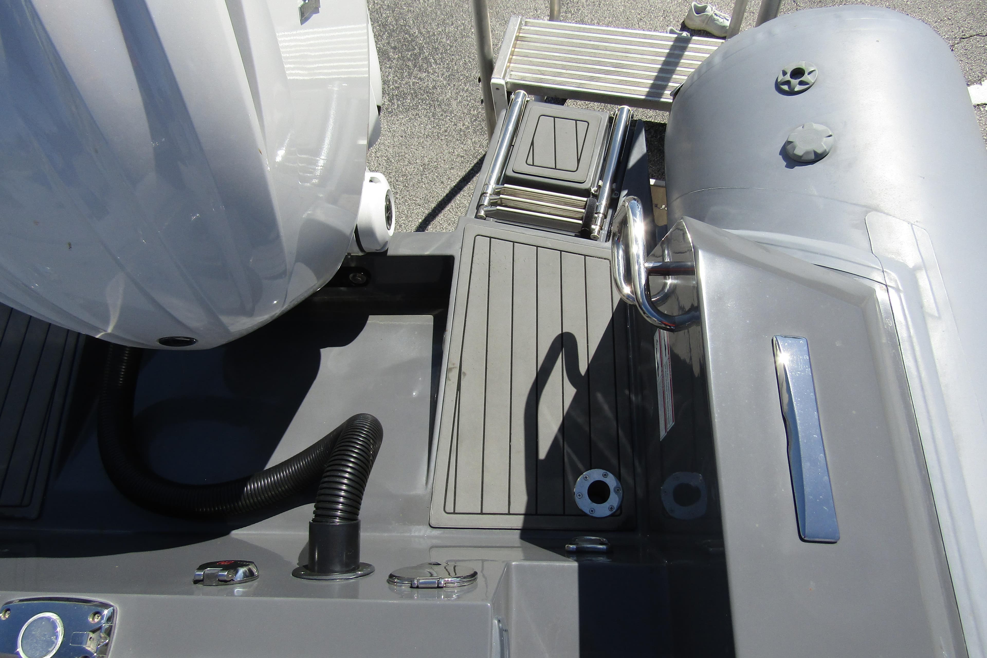 2024 Northstar Orion 8 boat deck with motor and ladder, showcasing sleek design.