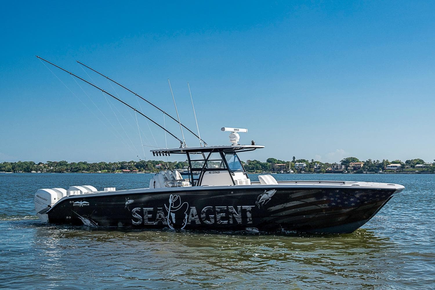 2018 Invincible 40 Catamaran on water, featuring custom graphics and multiple outboard engines.
