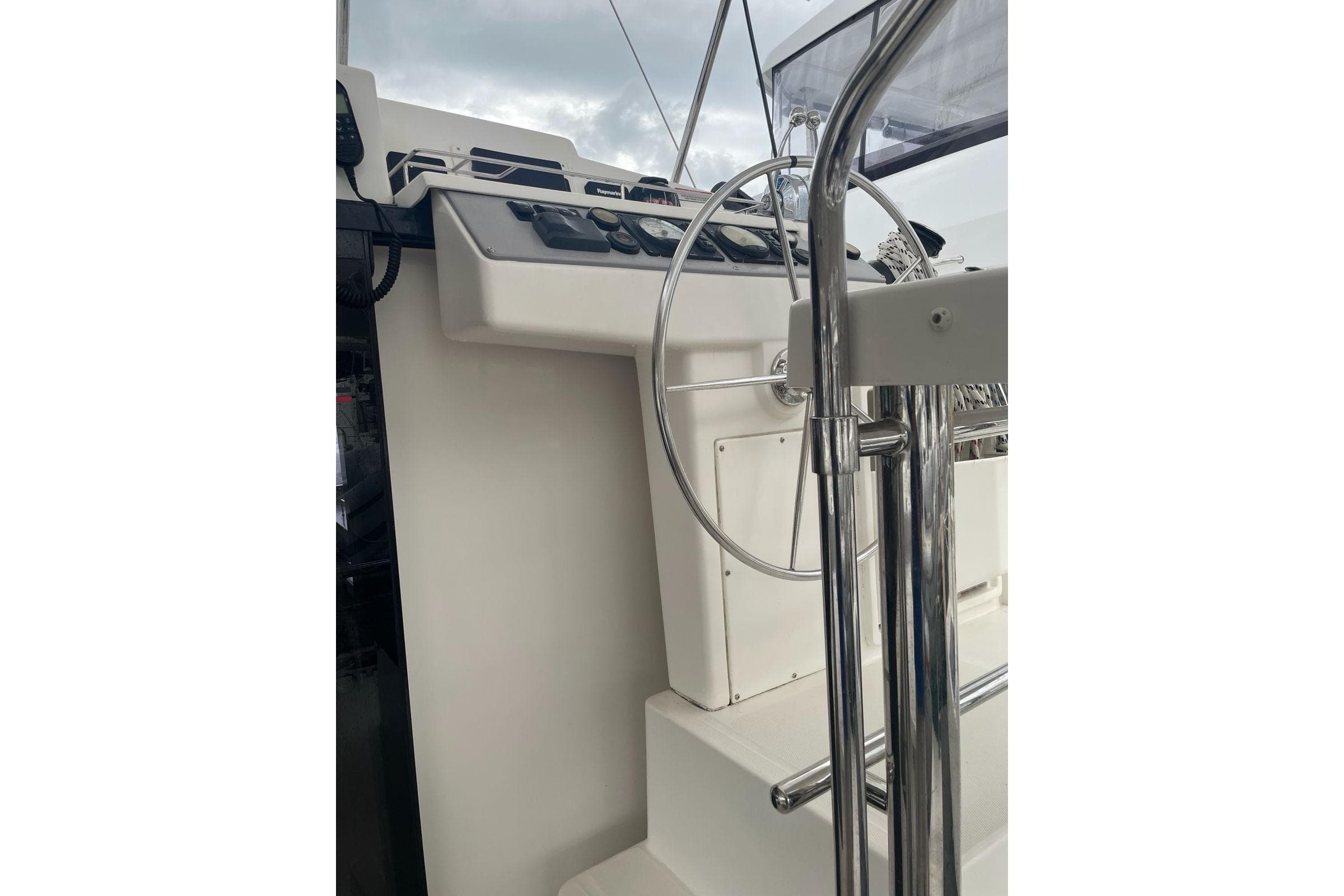 Helm of 2020 Leopard 40 catamaran with steering wheel and control panel.