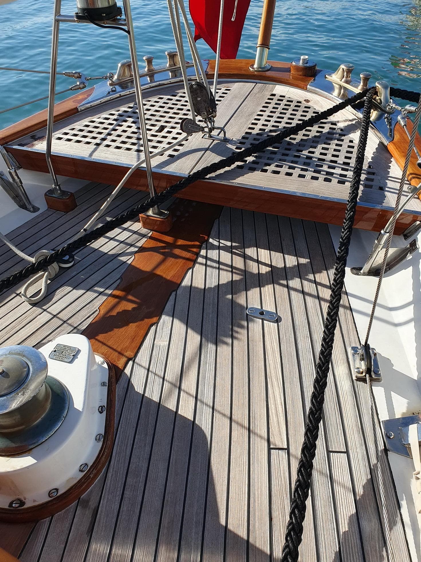 Classic 1933 Camper & Nicholsons 114FT Ketch deck with wooden details and nautical ropes.