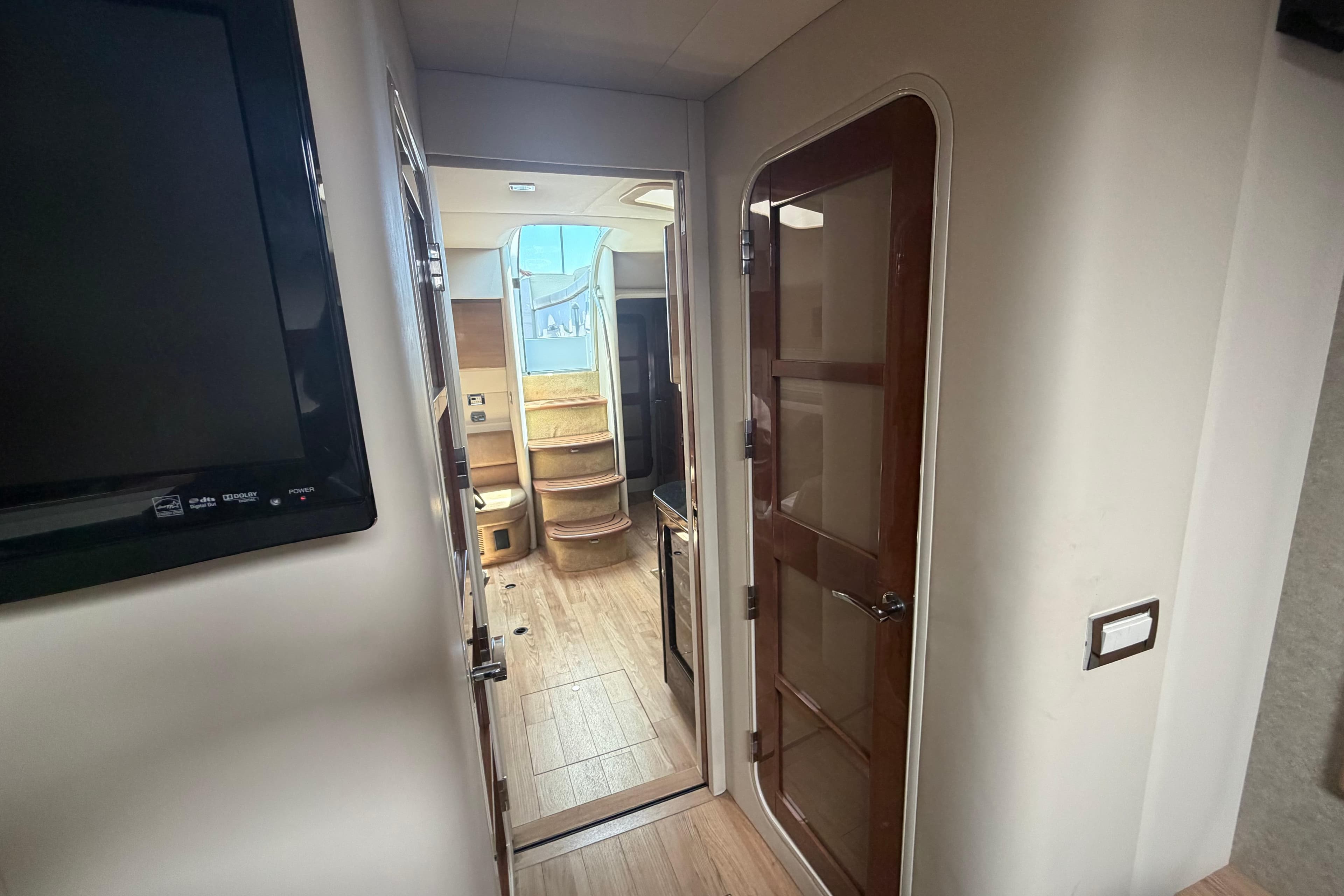 Interior view of a 2011 Formula 45 Yacht, featuring a hallway and wooden door.
