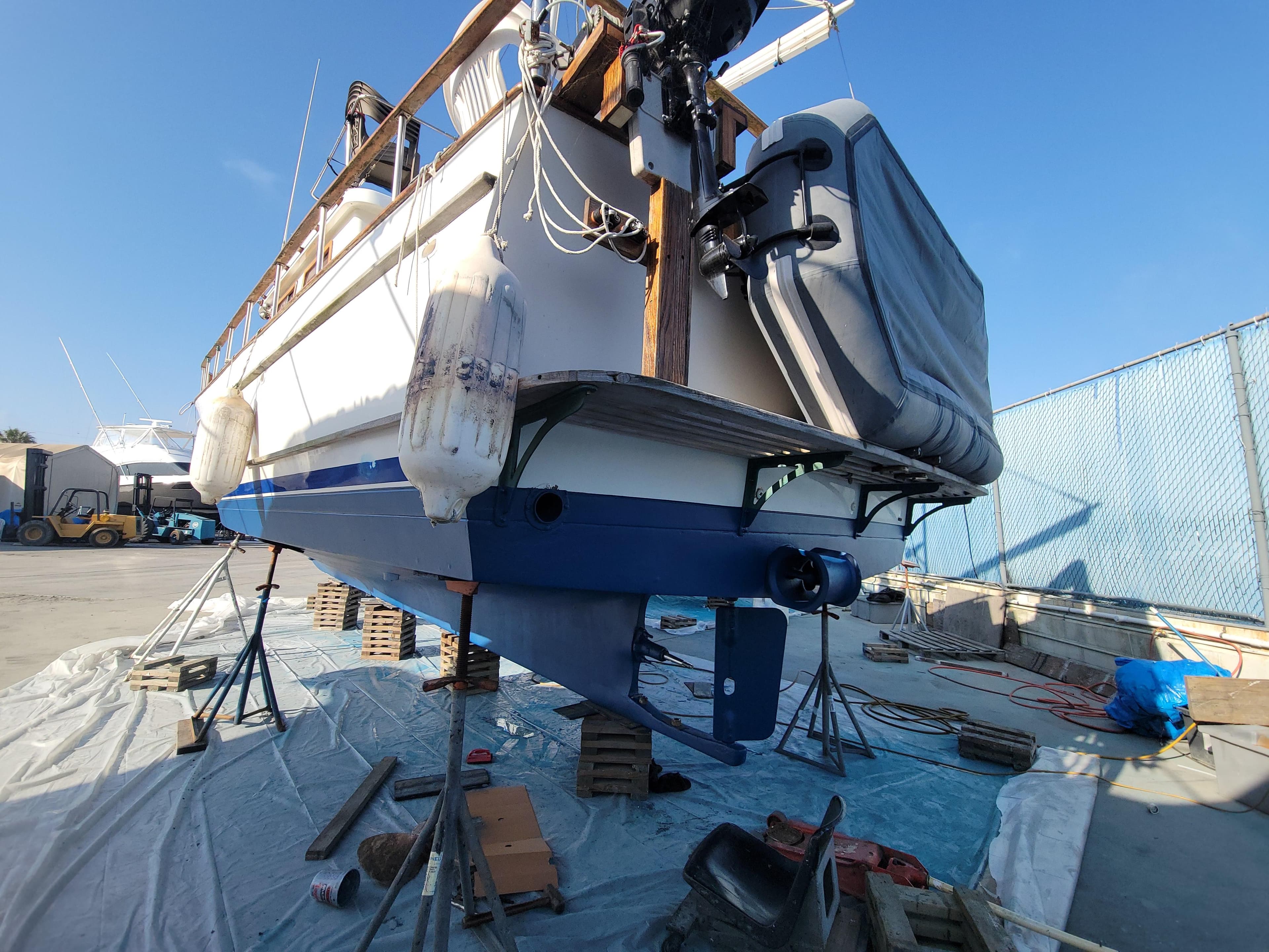 1977 CHB 34 boat on dry dock, undergoing maintenance with visible hull and propeller.