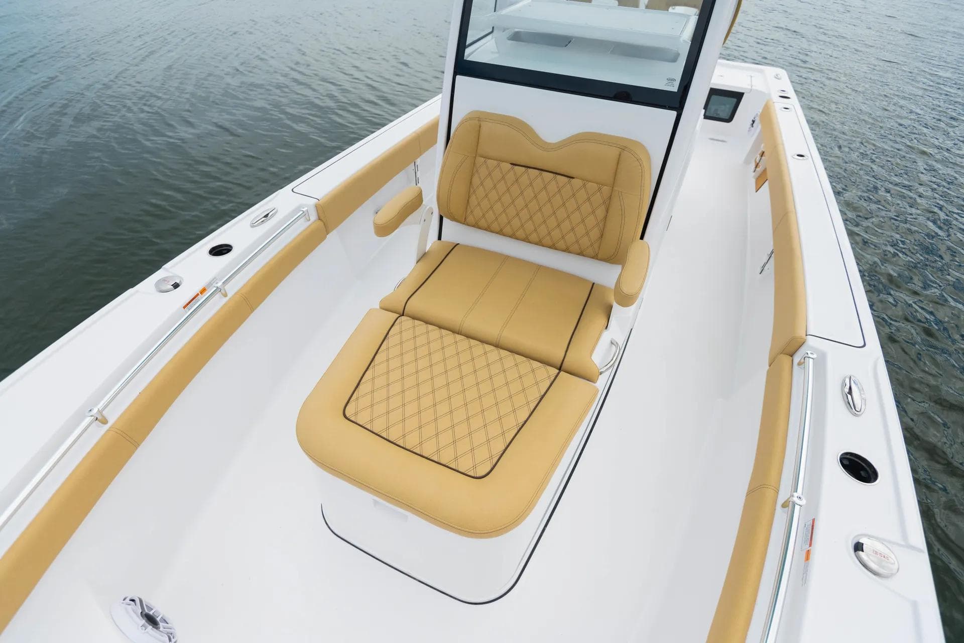Manufacturer Provided Image: 2025 Sportsman Masters 267OE Bay Boat with tan seating on calm water.