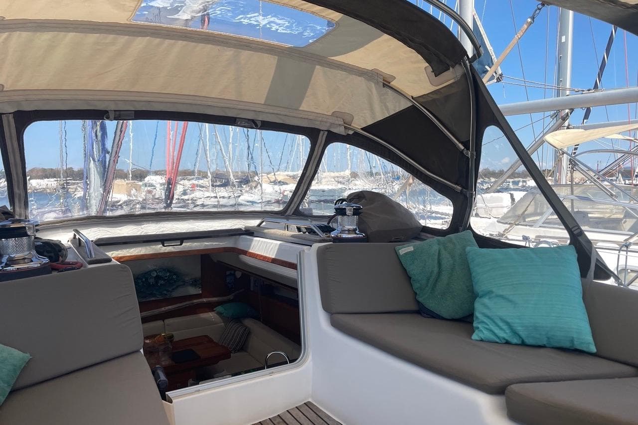 Interior view of 2015 Jeanneau Sun Odyssey 50 DS sailboat with comfortable seating and cushions.