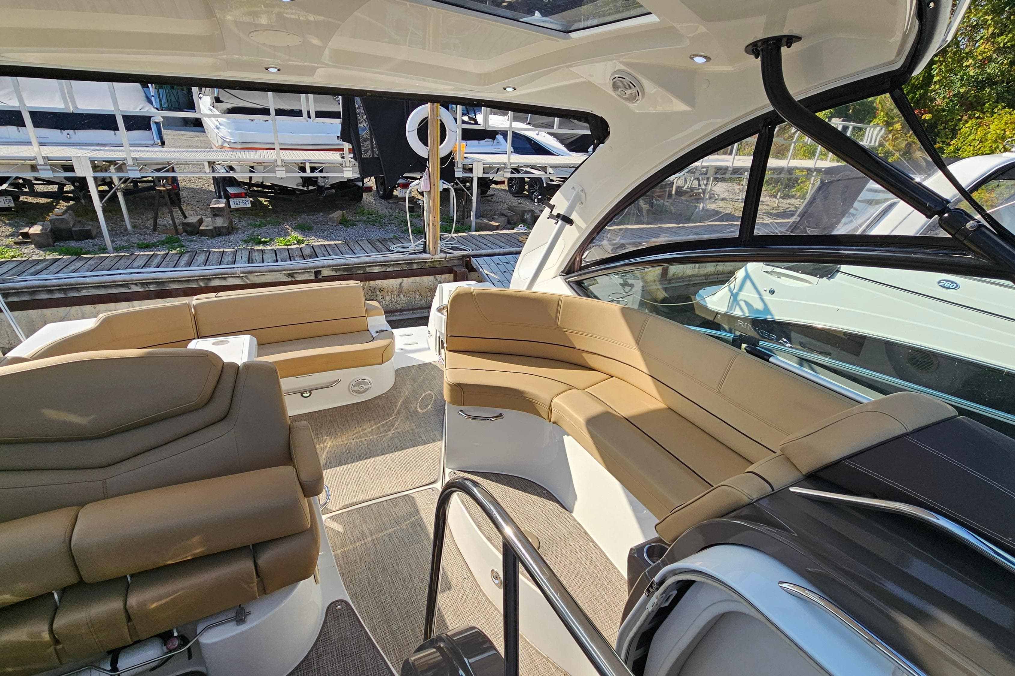 2017 Cruisers Yachts 380 Express interior with tan seating and sleek design.