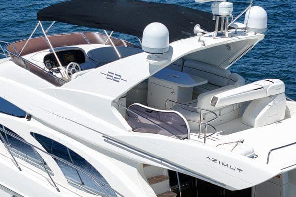 2007 Azimut 62 yacht with sleek design and spacious deck on blue water.