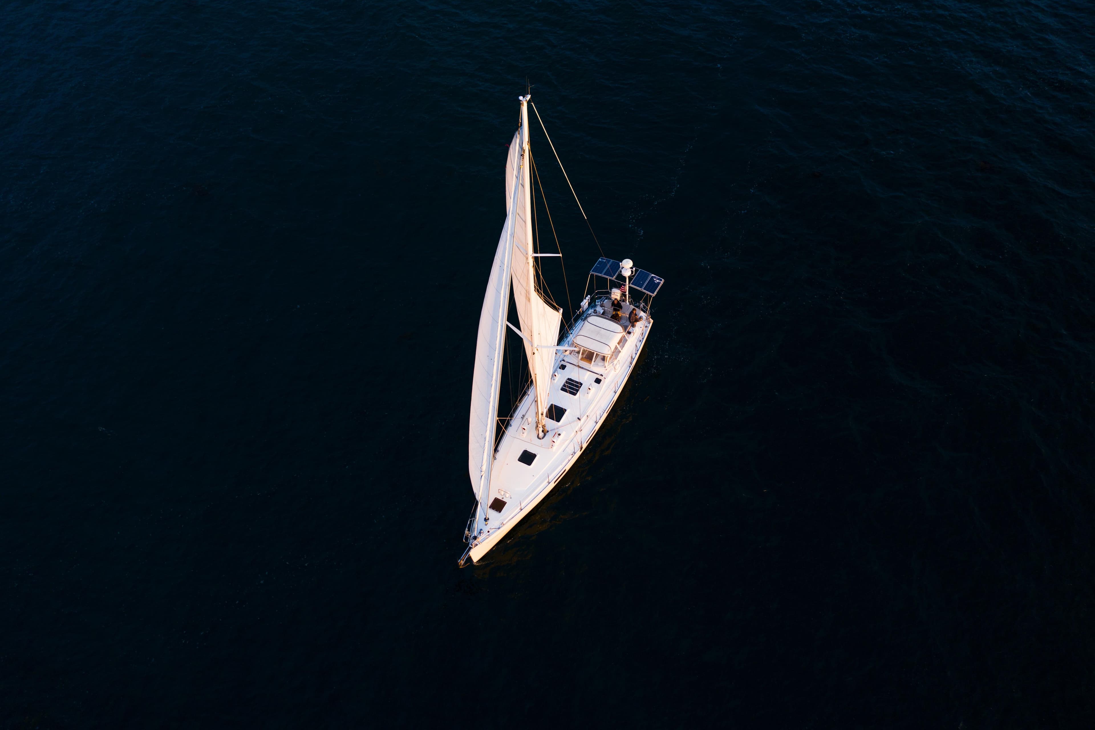 Aerial view of 1995 Sundeer 56 sailboat navigating calm waters.
