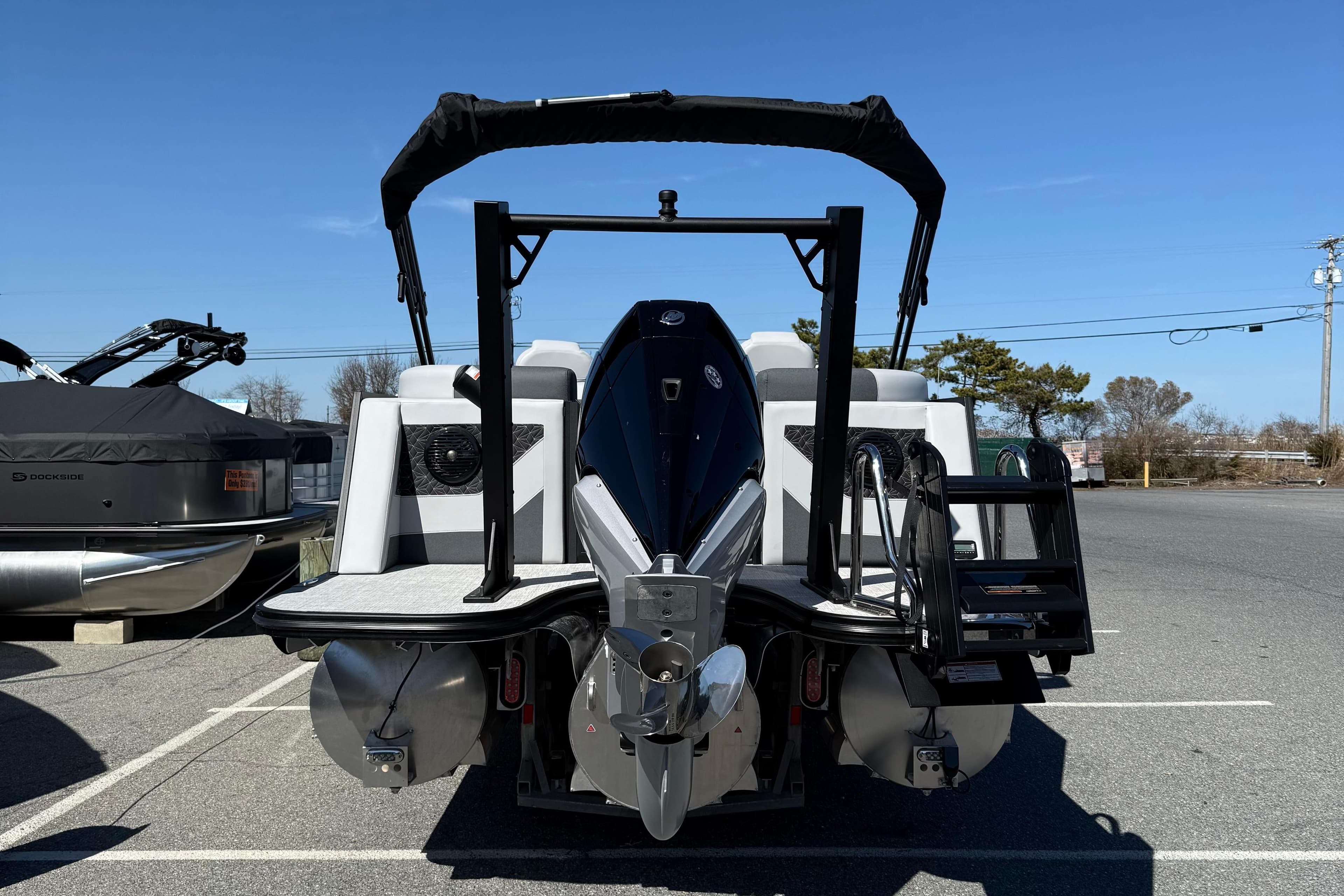 2026 Alera M23Q boat with sleek design and powerful engine, parked outdoors.