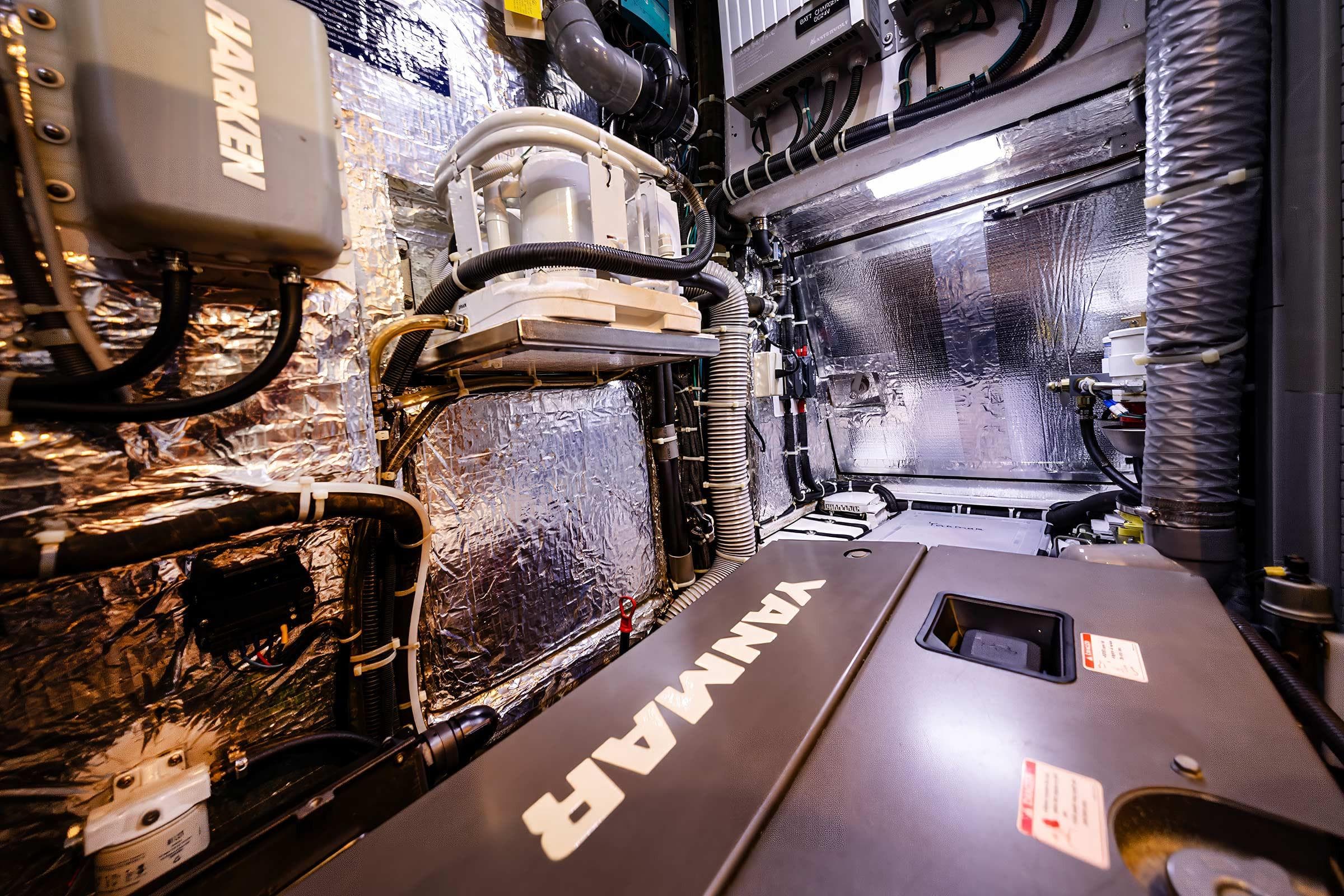 Engine room of a 2014 Hylas 63 yacht featuring Yanmar equipment and Harken components.