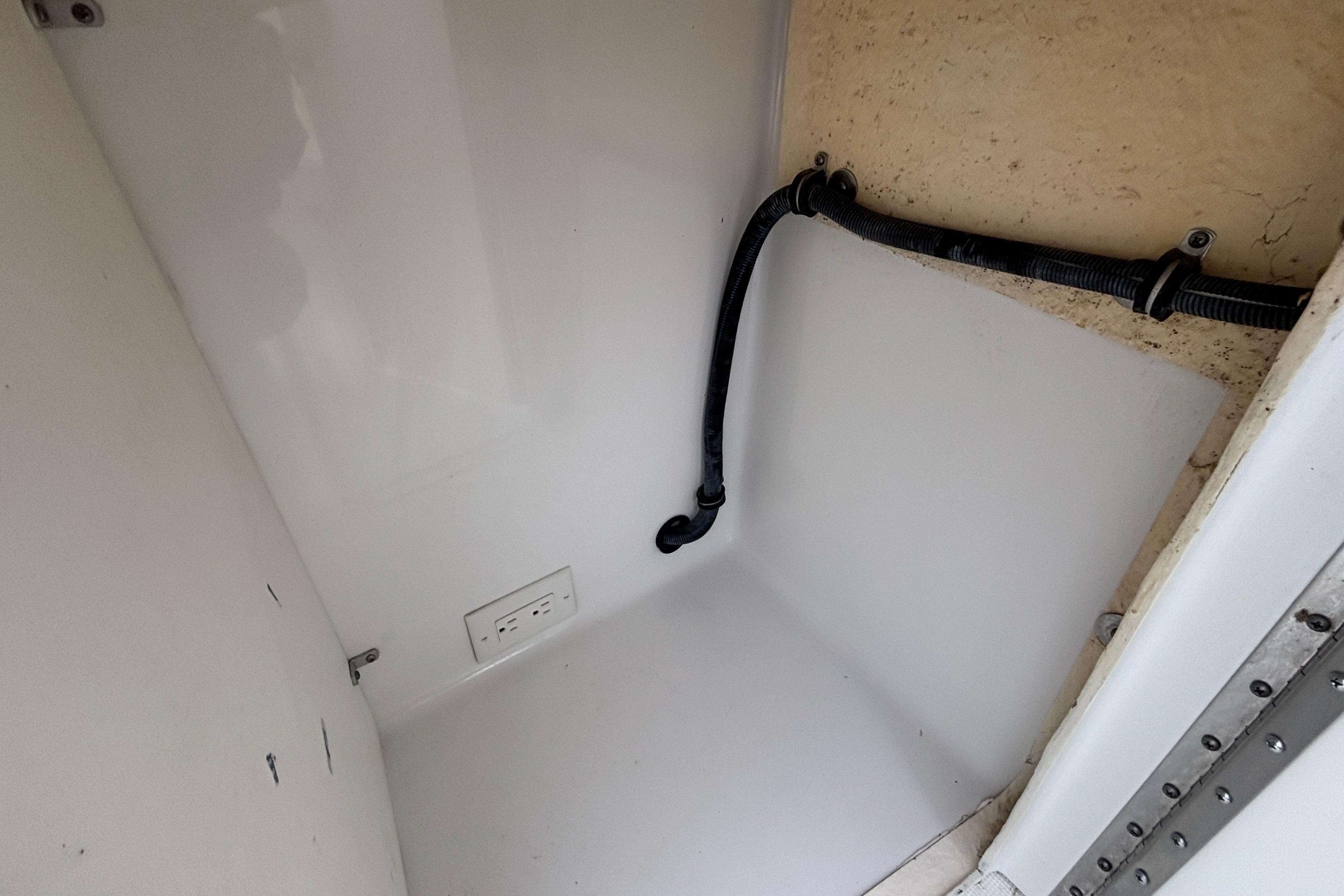 2005 Formula 31 Performance Cruiser interior with outlet and wiring detail.