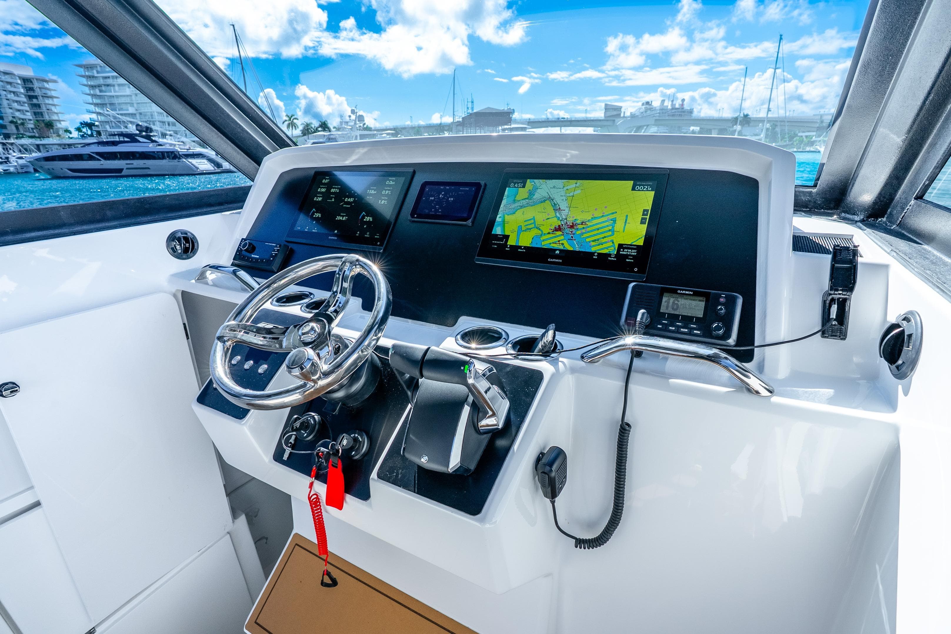 Helm of 2026 Hammer Yachts 35HH with navigation screens and steering wheel.