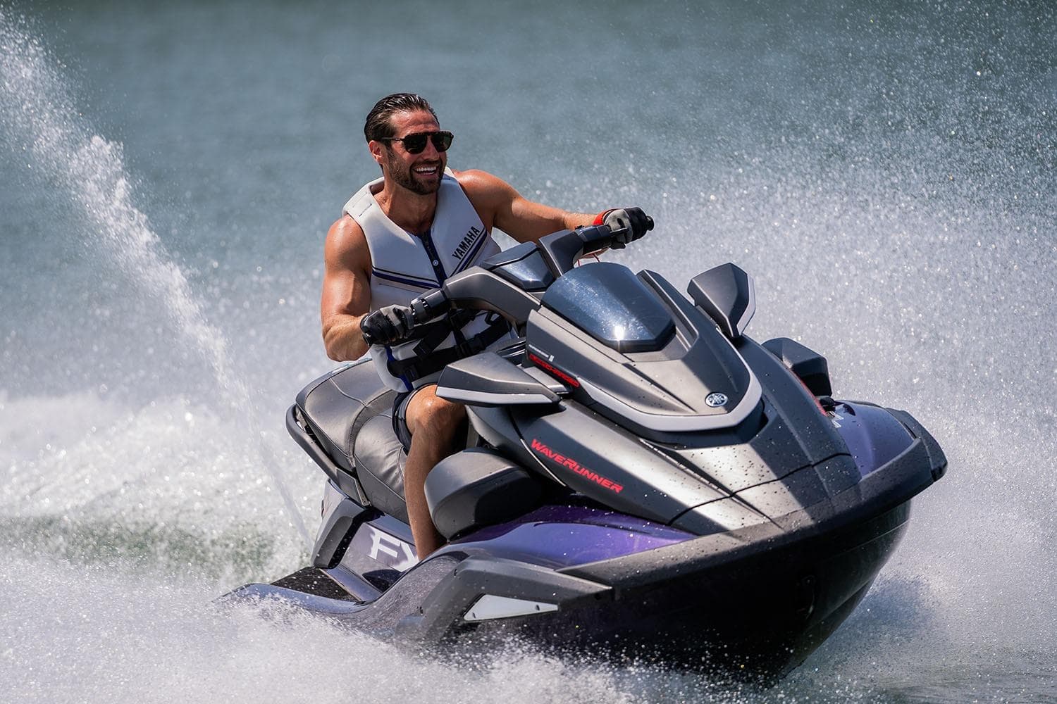 Manufacturer Provided Image: Man riding 2026 Yamaha WaveRunner FX SVHO on water, creating splashes.