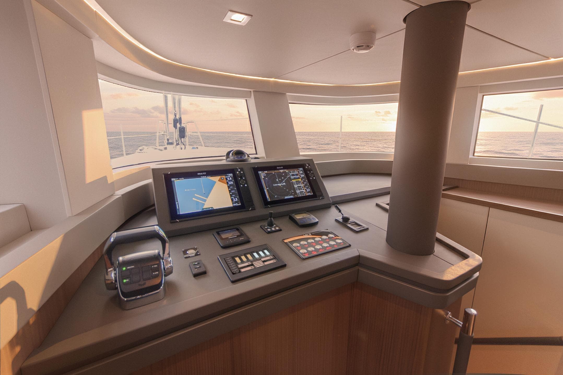 Helm of 2025 MCP Global Exp 68 yacht with navigation screens and ocean view.