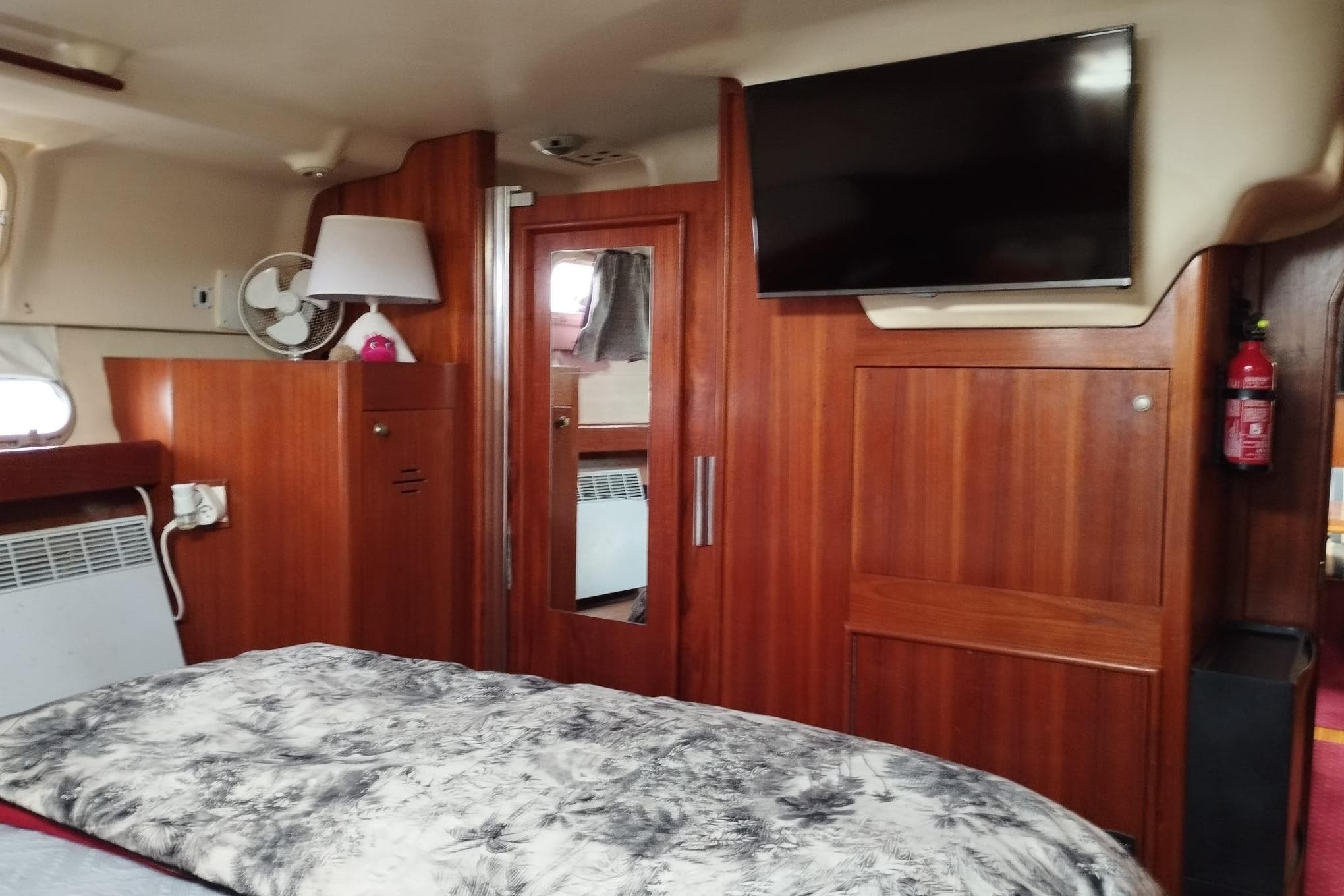 Interior of 1998 Hunter Passage 450 yacht with wood paneling and modern amenities.