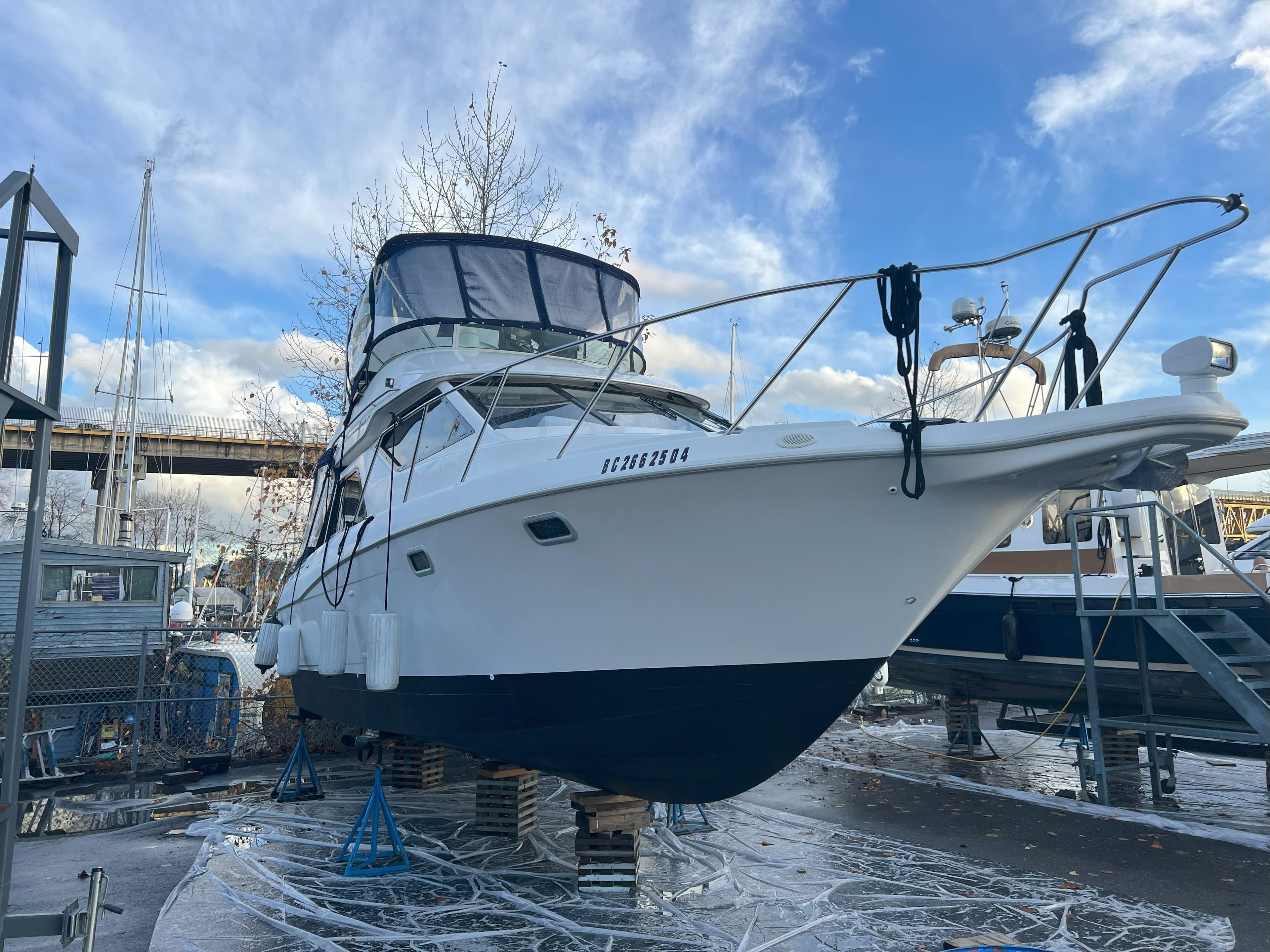 2001 Bayliner Ciera 3258 Command Bridge boat on dry dock, ready for maintenance.