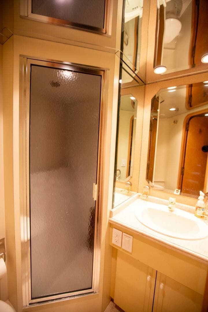 Luxurious bathroom in 1999 Tarrab Motor Yacht with shower and vanity.
