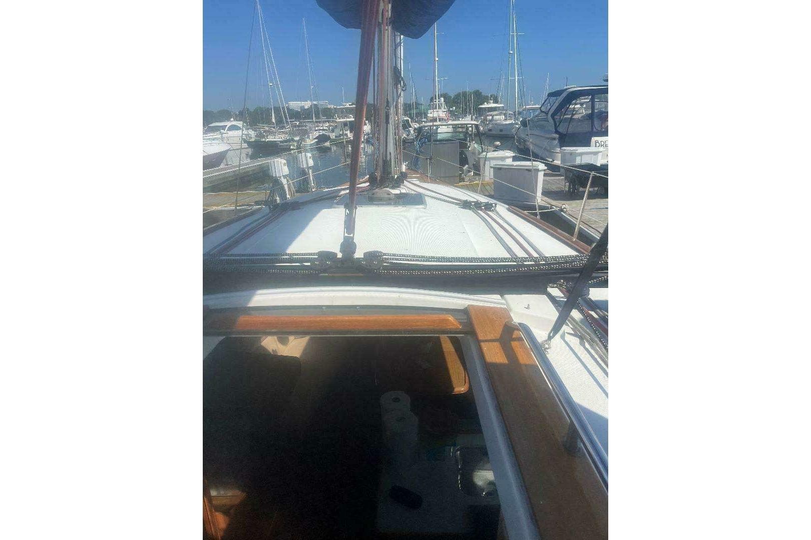 2007 Jeanneau Sun Odyssey 39i sailboat docked at marina, view from deck.