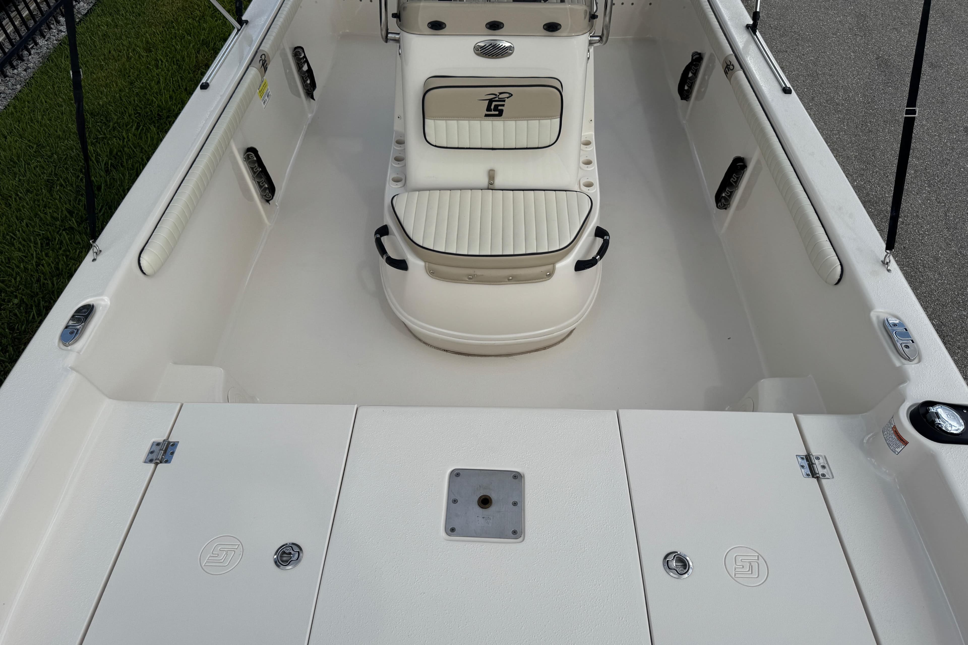 2022 Carolina Skiff 19 LS boat interior with seating and storage compartments.