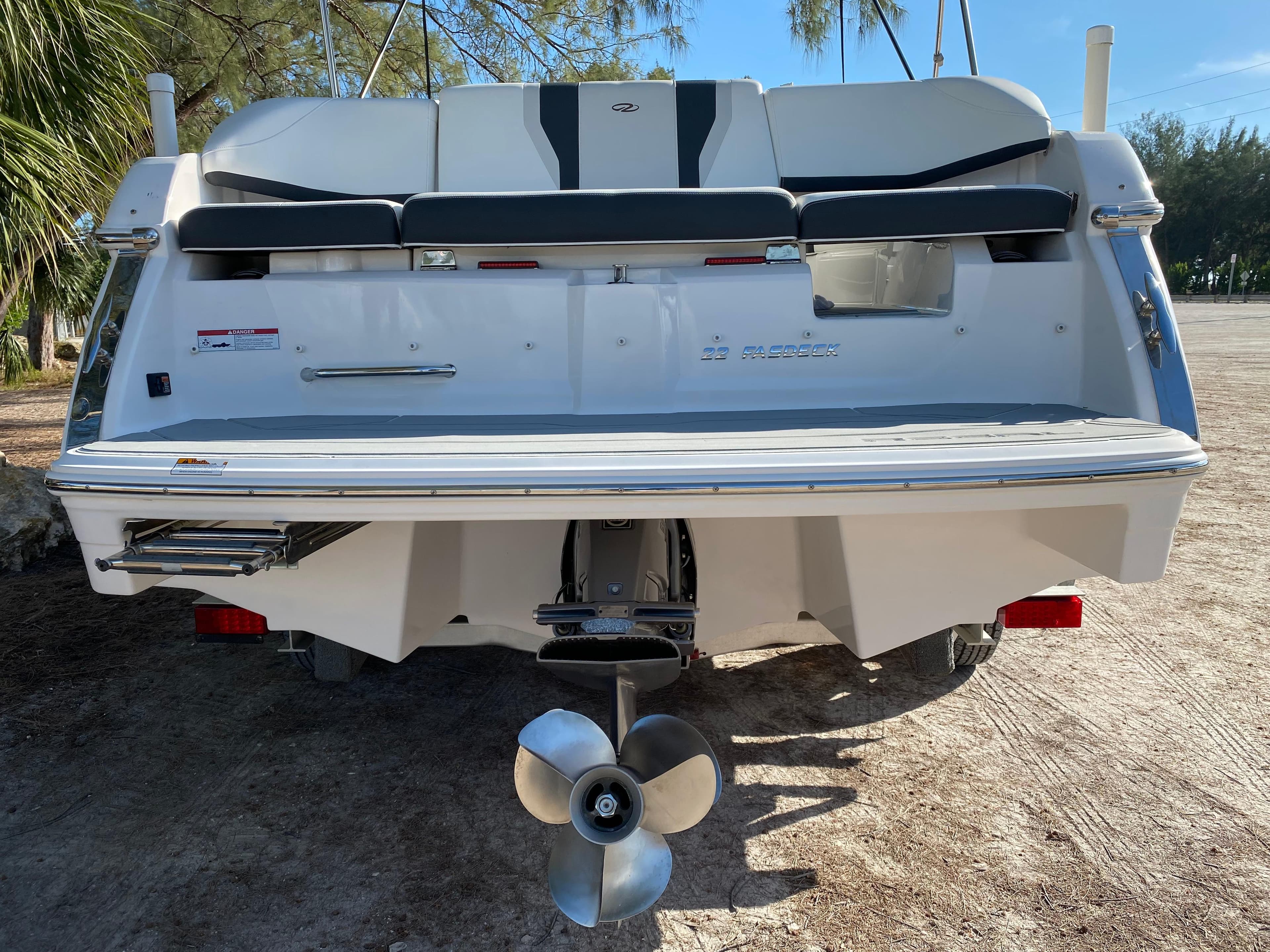 2017 Regal 22 FasDeck boat stern with propeller and swim platform.
