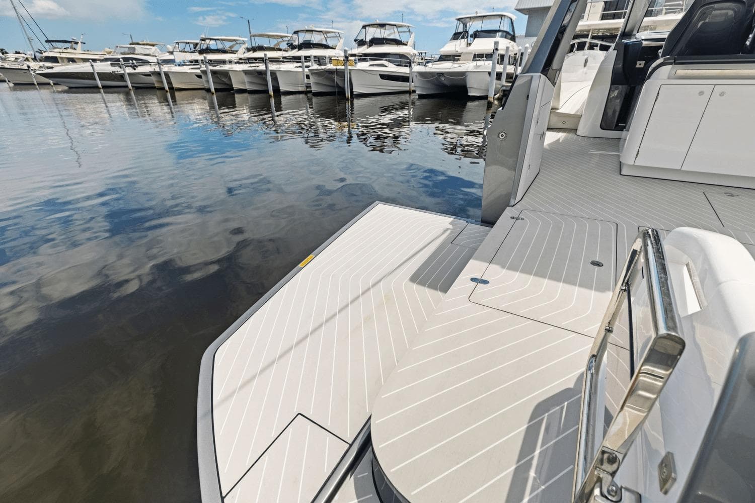 Azimut Verve 48 yacht, 2026 model, docked with sleek deck design and marina view.