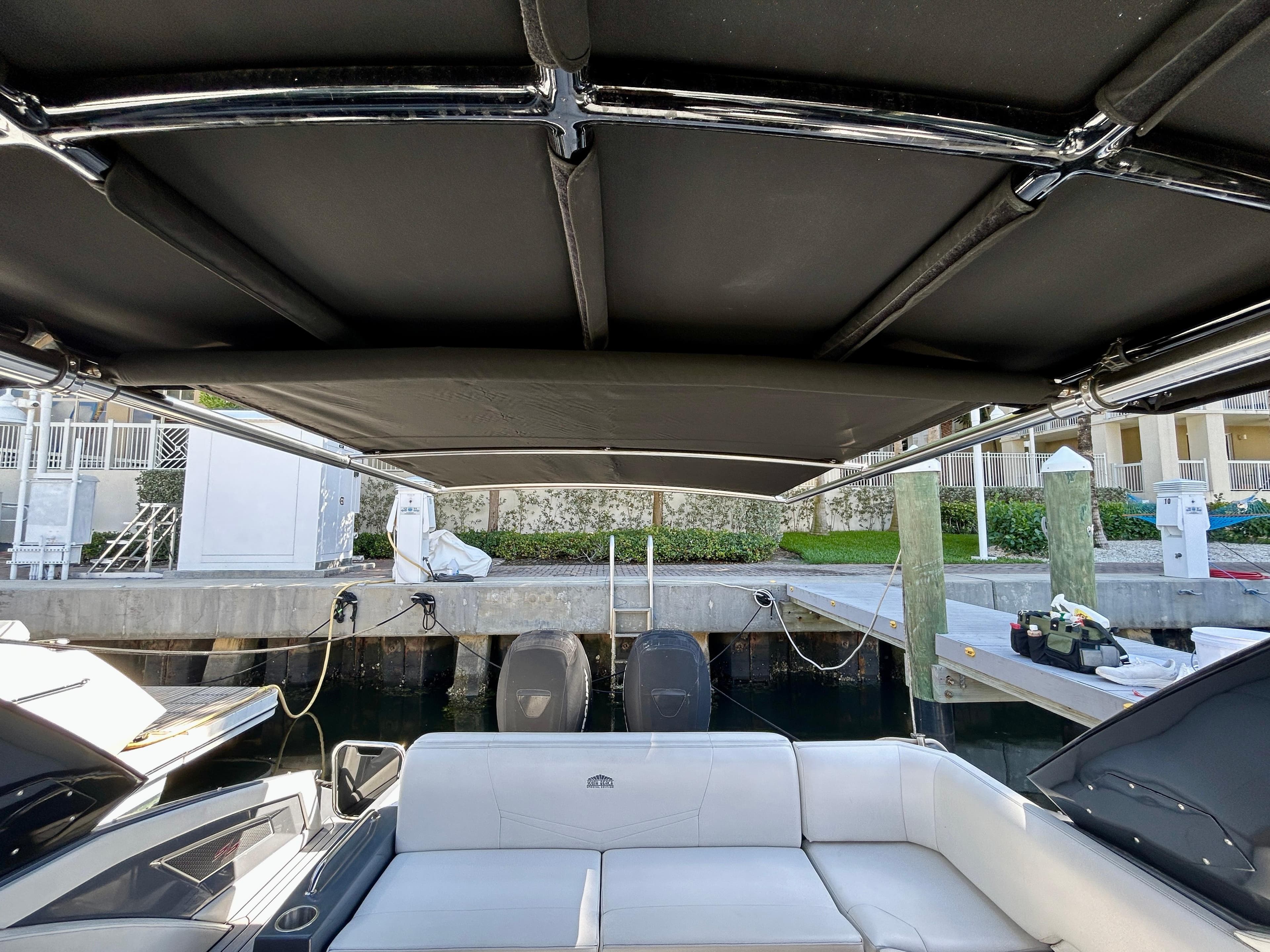 2021 Cruisers Yachts 338 South Beach Edition Bow Rider interior with canopy and seating.