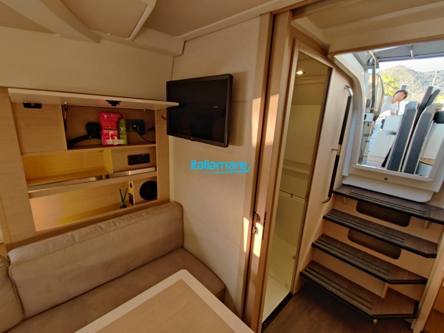 Interior of 2020 Jeanneau Leader 36 yacht, featuring cozy seating and modern amenities.