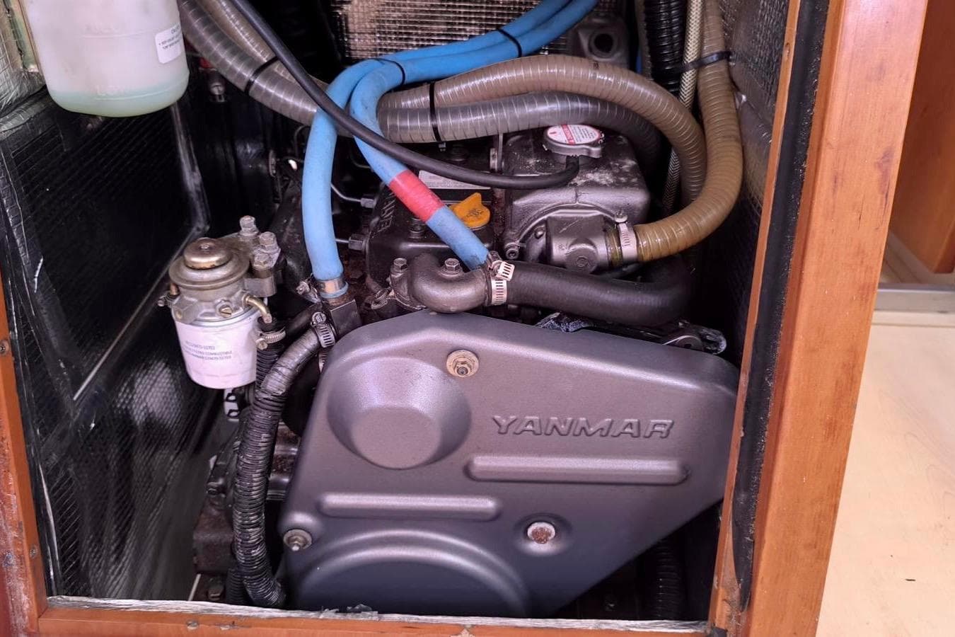 Engine compartment of a 2007 Hanse 470e sailboat with Yanmar engine.