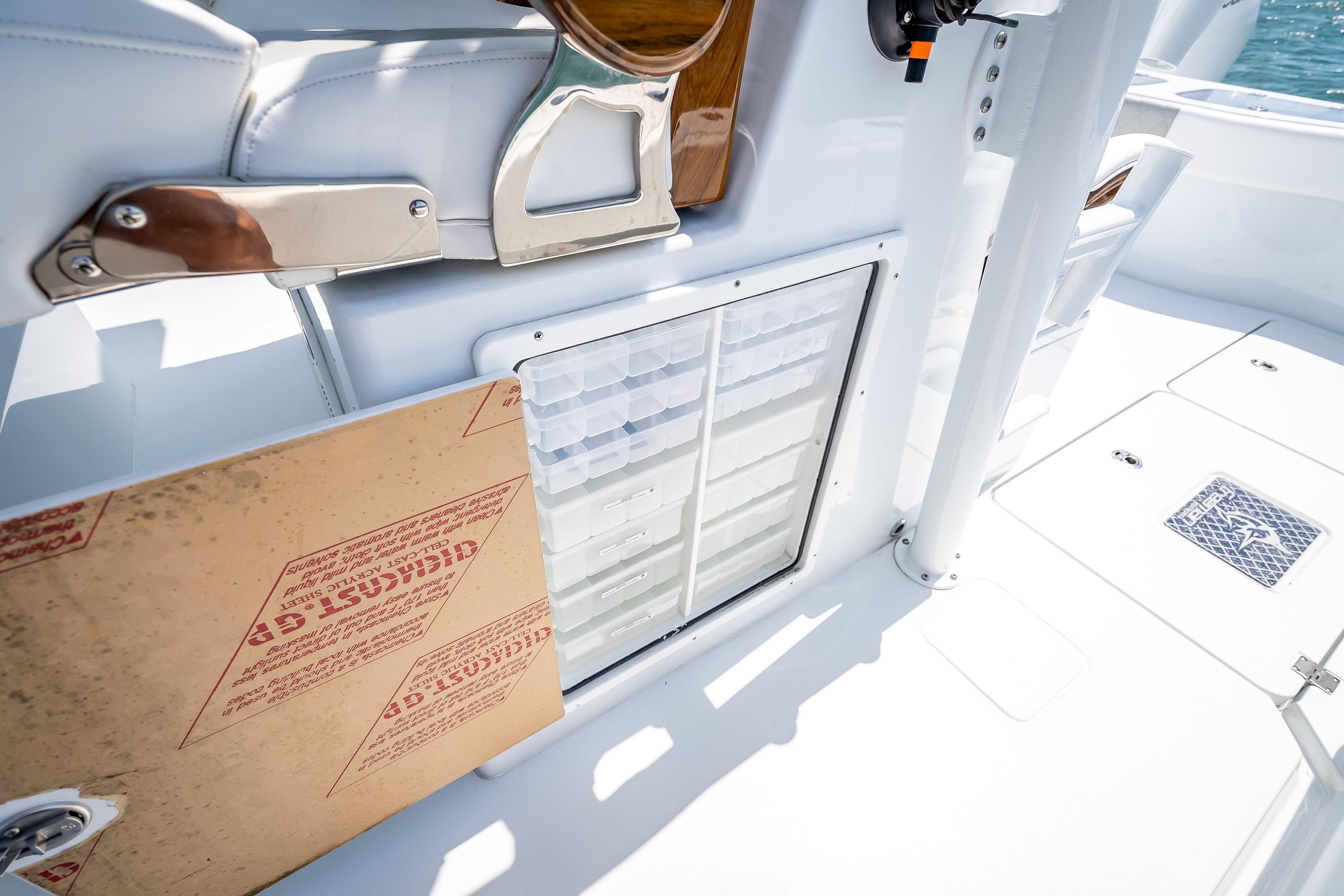 Freeman 43 boat interior, 2025 model, featuring storage compartments and sleek white design.