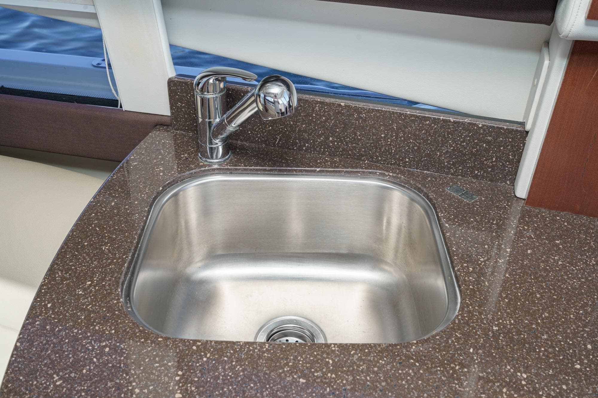 Stainless steel sink in 2011 Meridian 341 Sedan yacht kitchen area.