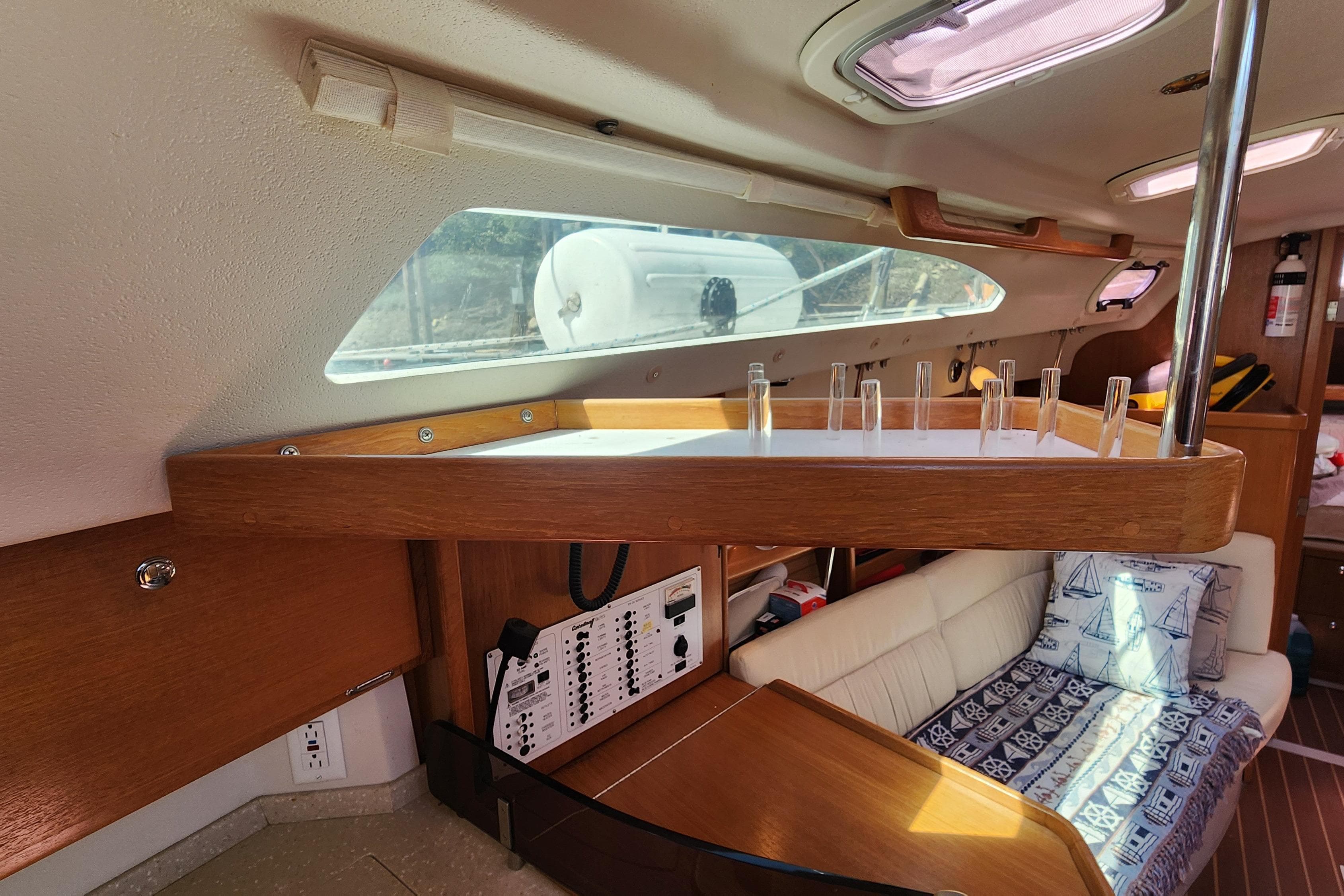 Interior of 2007 Catalina 320 MkII sailboat with wood accents and seating area.