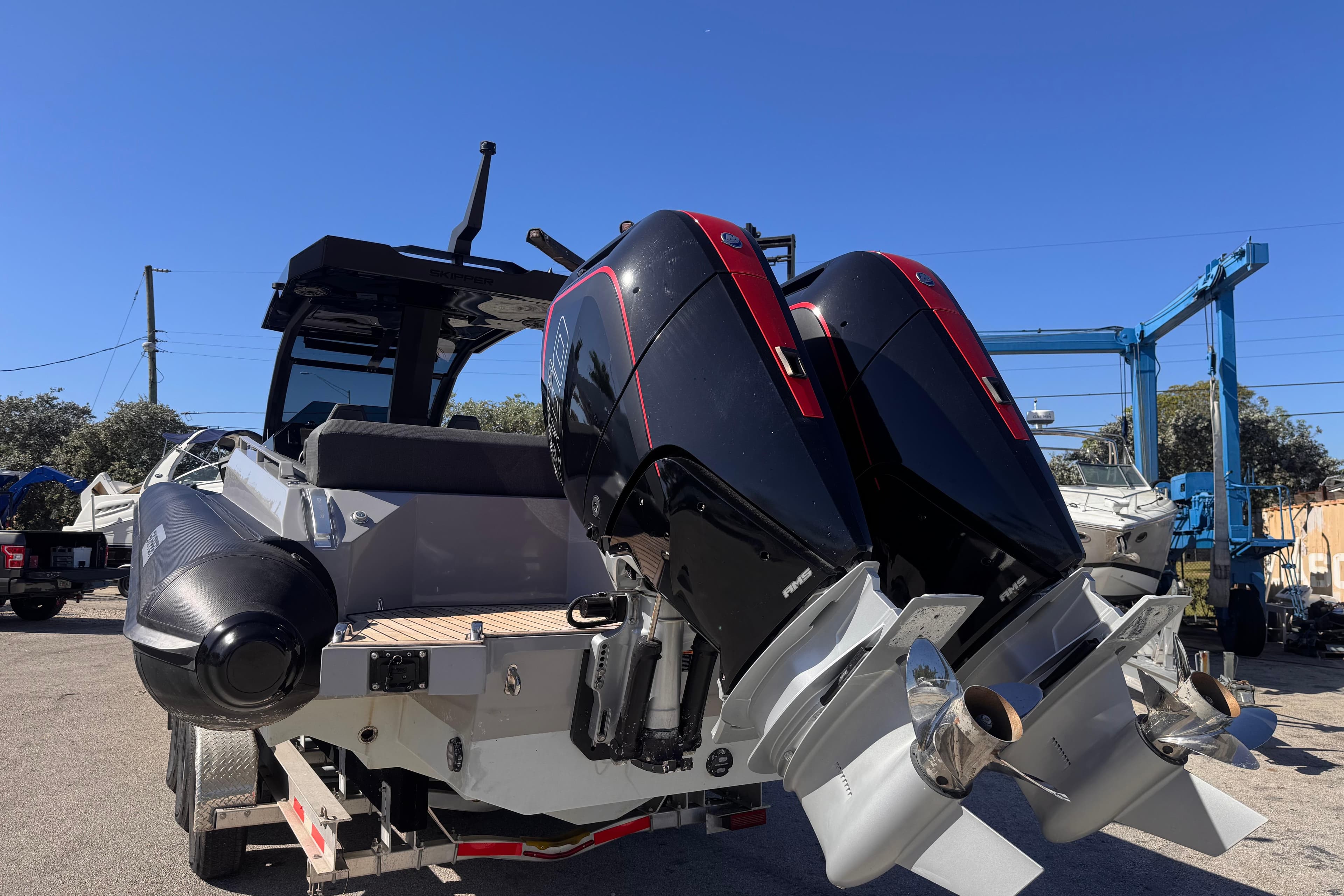 2025 Skipper-BSK 38NC boat with dual outboard engines on a trailer.