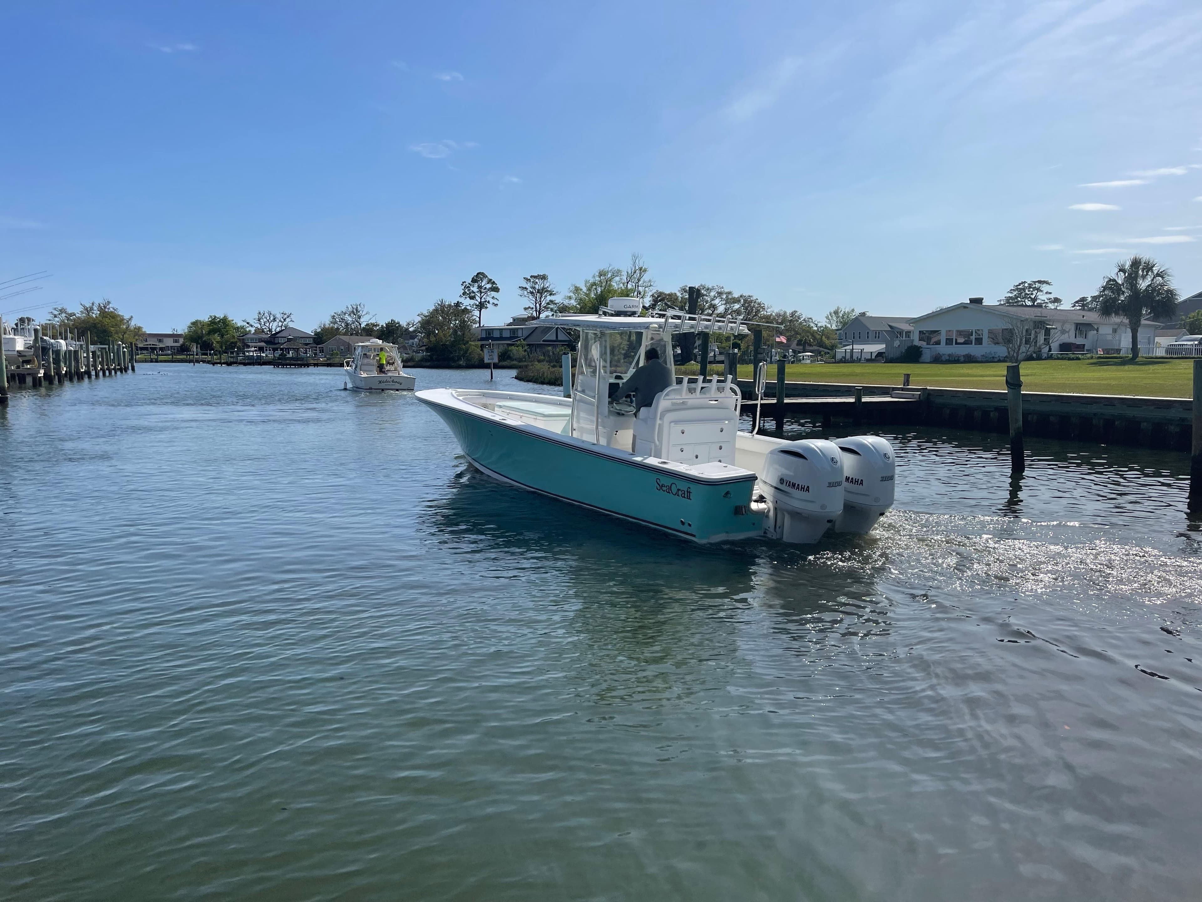 SeaCraft 32 boat with Yamaha F300 engines on calm water.