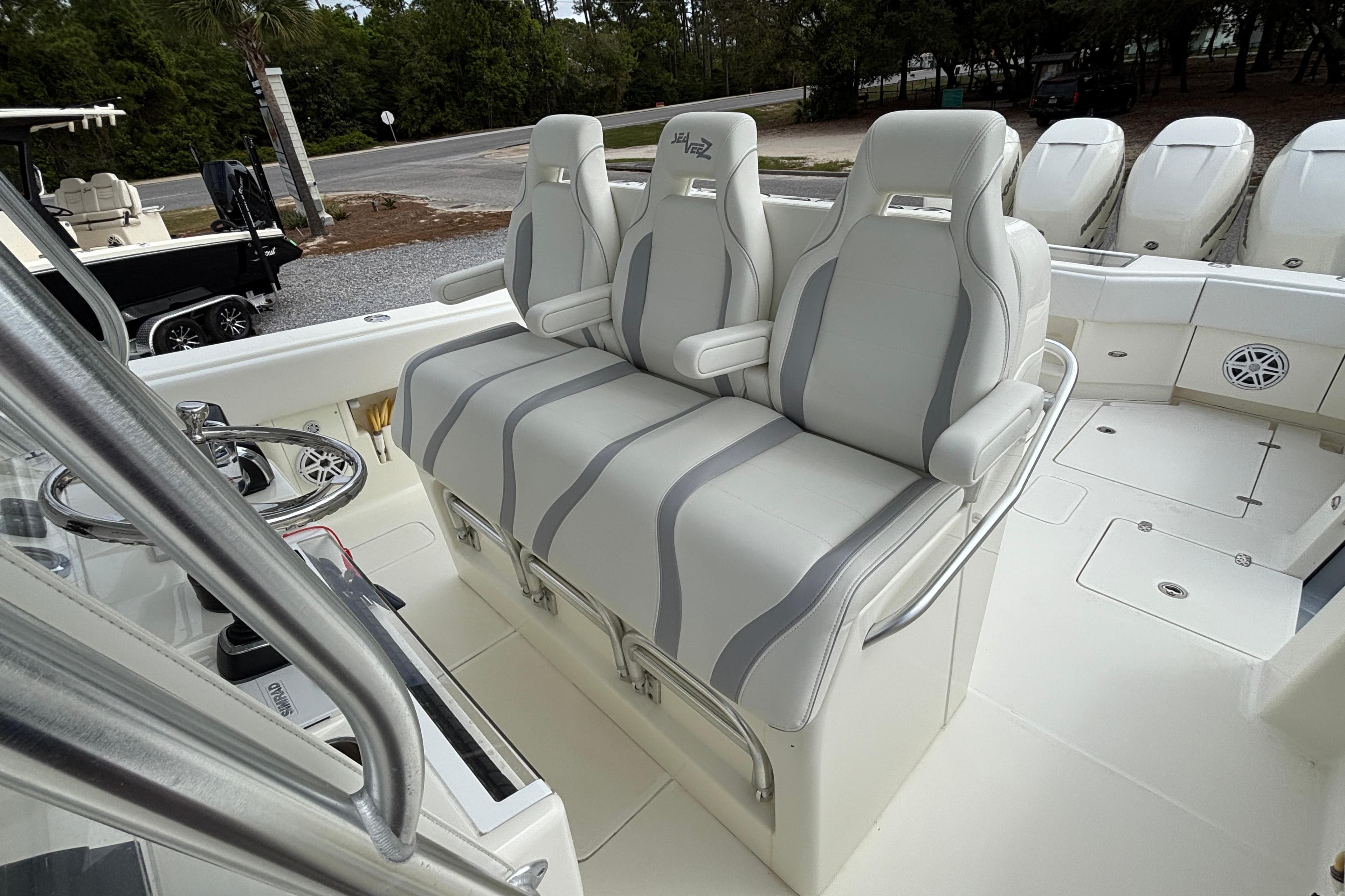 2018 SeaVee 390Z boat interior with three cushioned seats and sleek design.